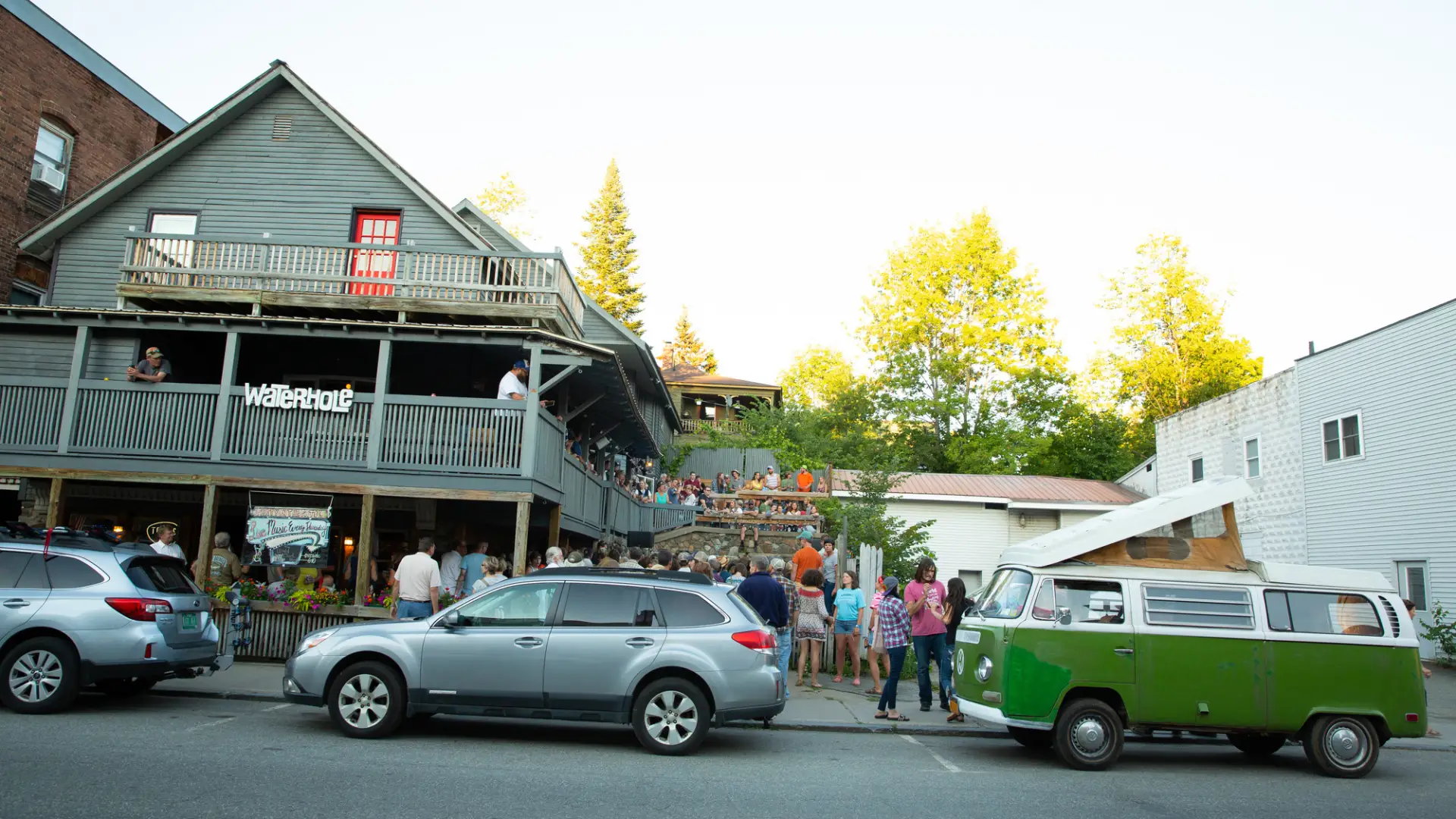 Cars and people lined up in front of The Waterhole.