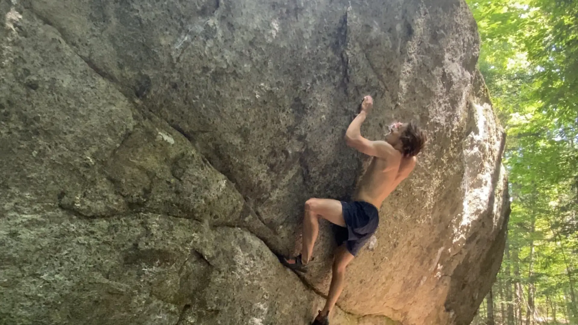 A bouderer on a rock face