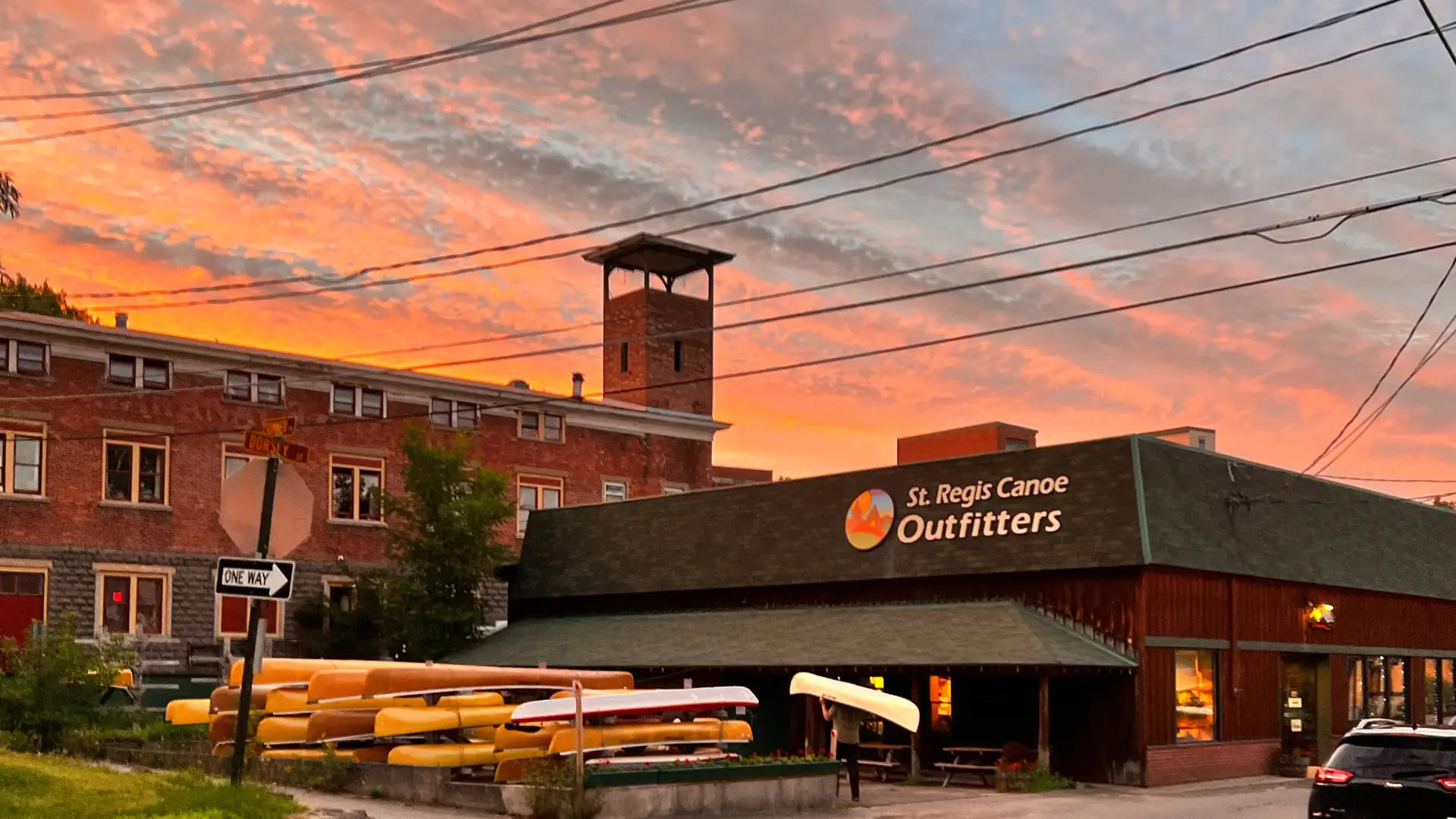 Gorgeous pink and orange sunset over St Regis Canoe Outfitters shop.