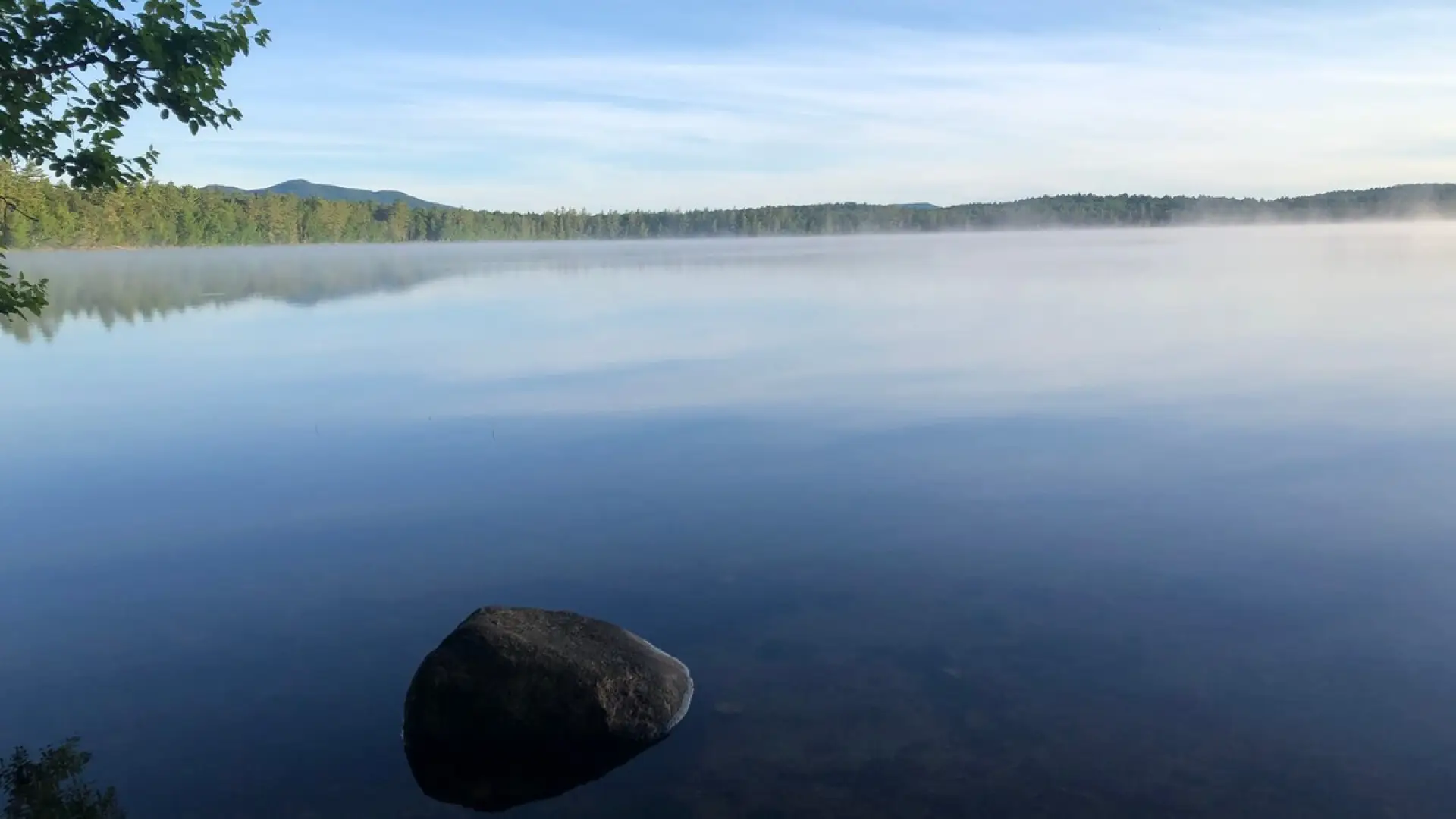 The smooth as glass waters of Lake Clear