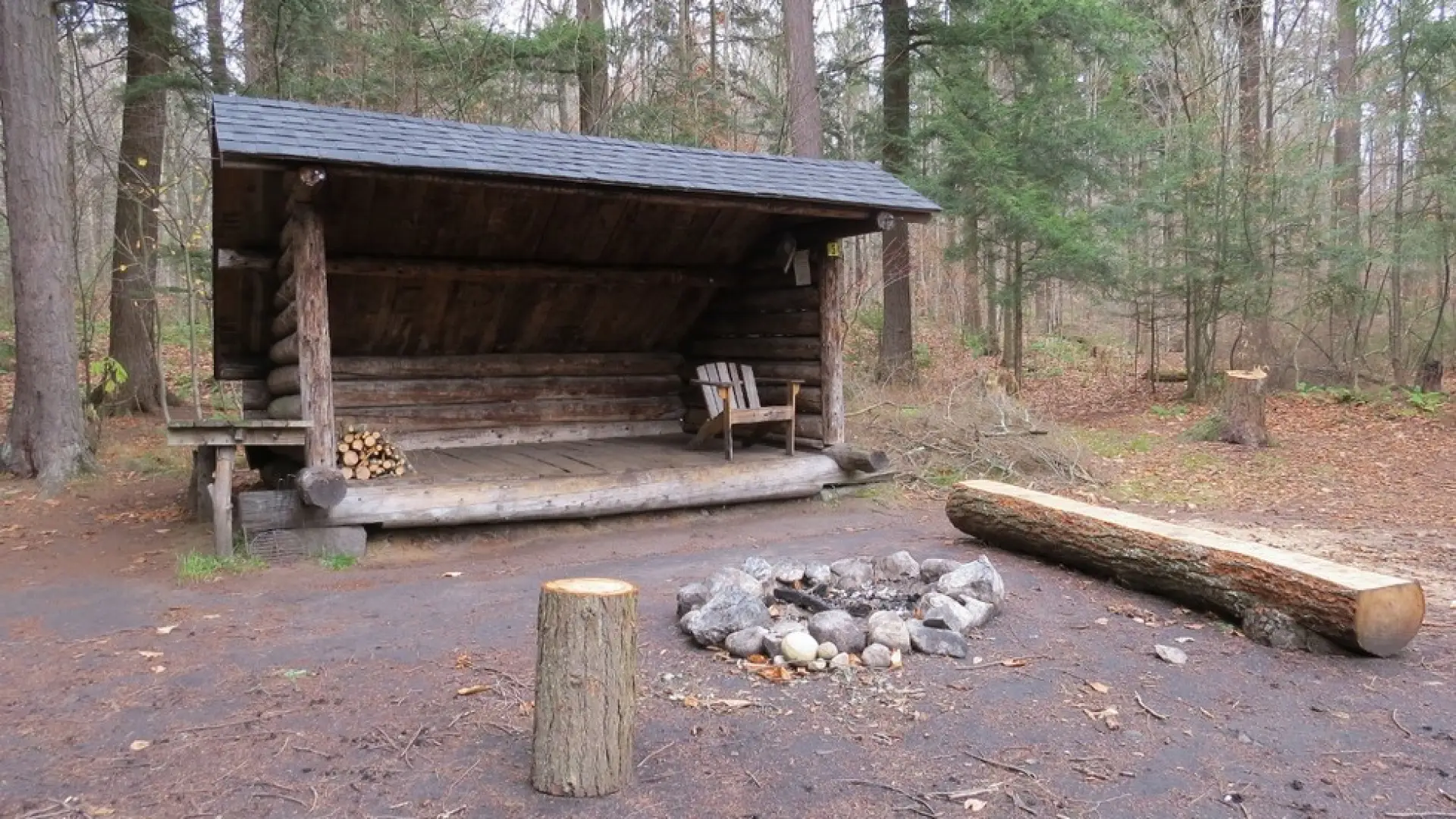 A lean-to with a firepit