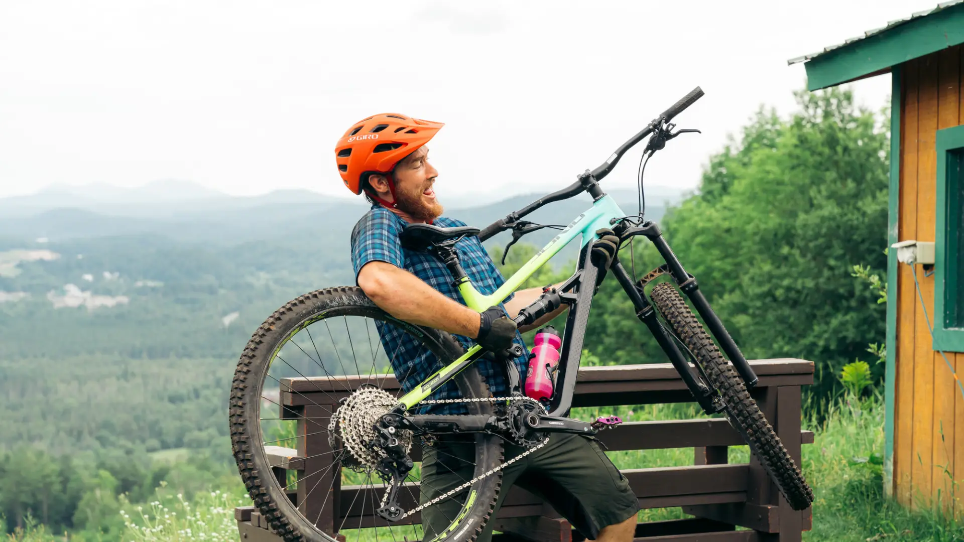A mountain biker uses his bike as a guitar
