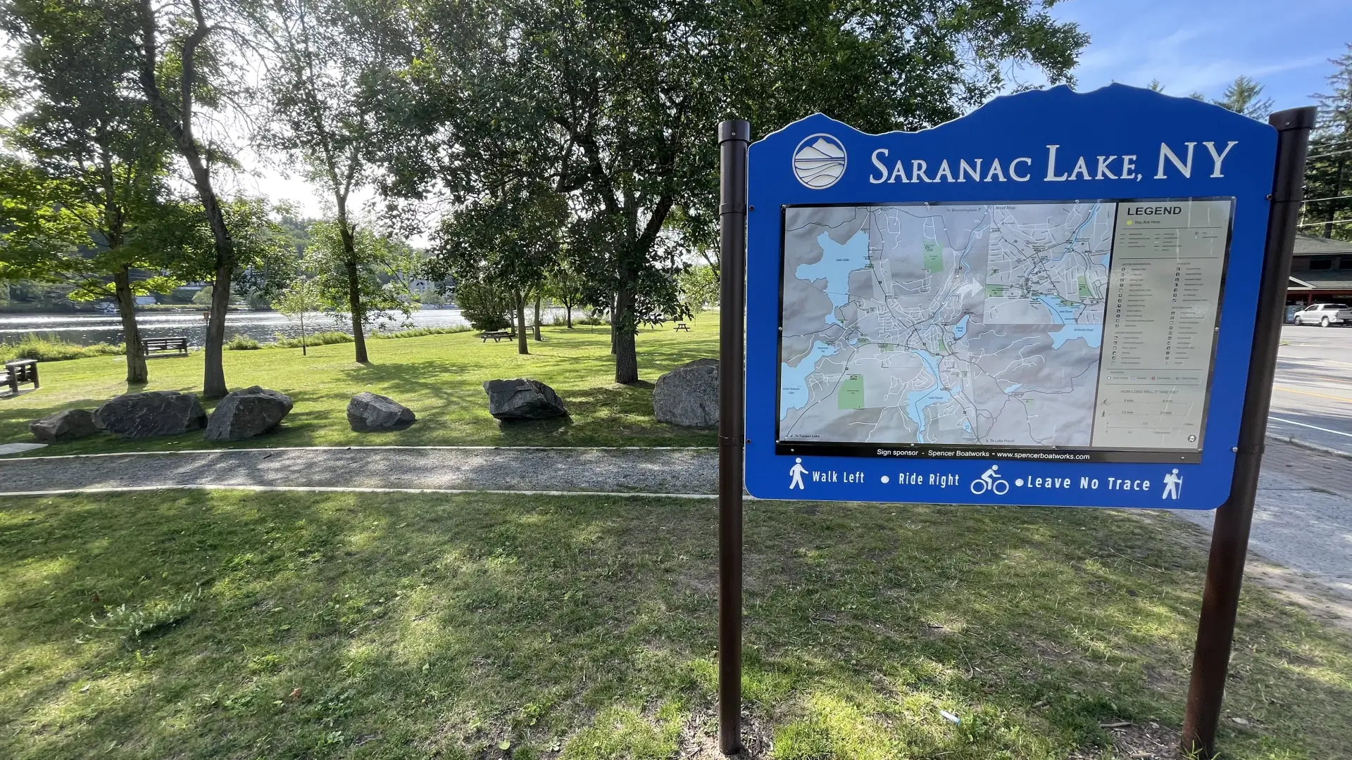 A sign of Saranac Lake in the park