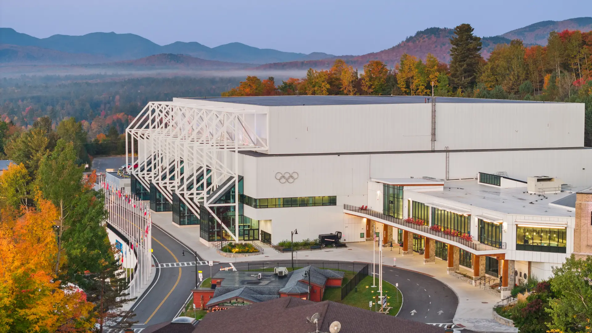 Olympic Center building where hockey rinks are located seen from aerial exterior in fall