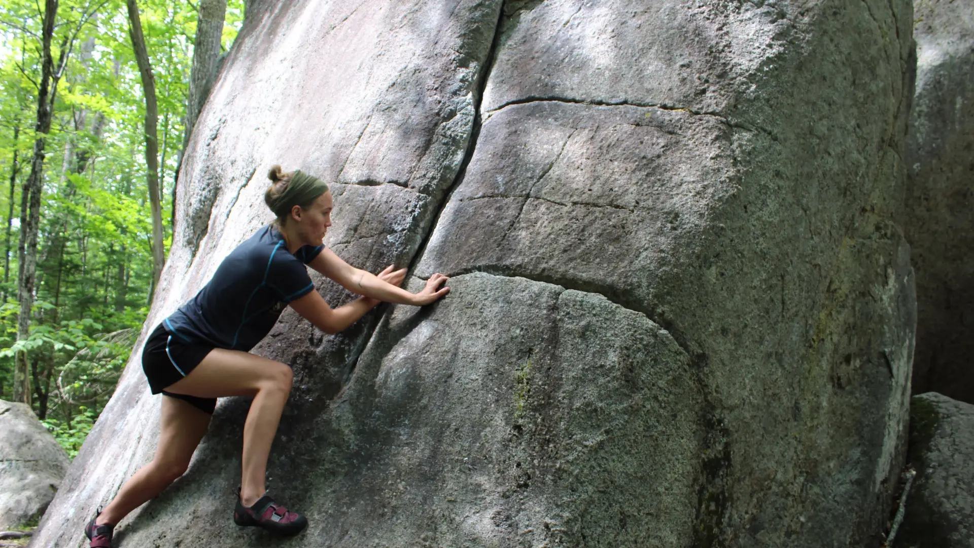 A climber moves up a classic slab