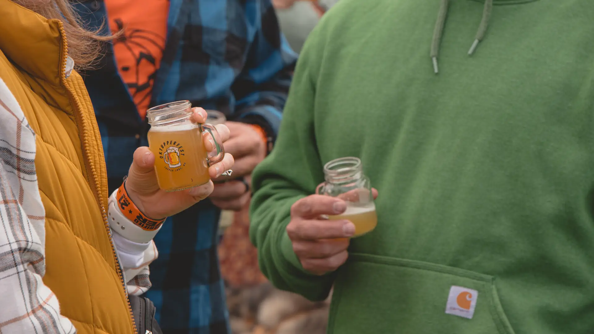 Close up of a couple drinking beer samples at OkTupperfest