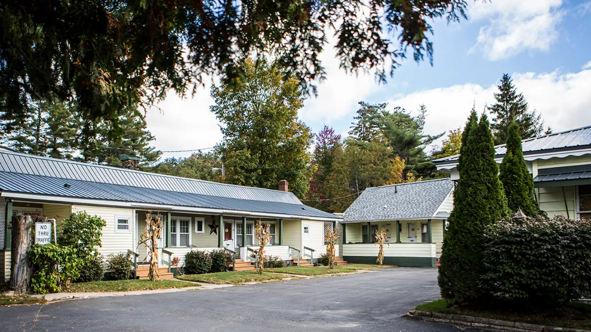 The exterior of two building and the parking lot of The Ashley.