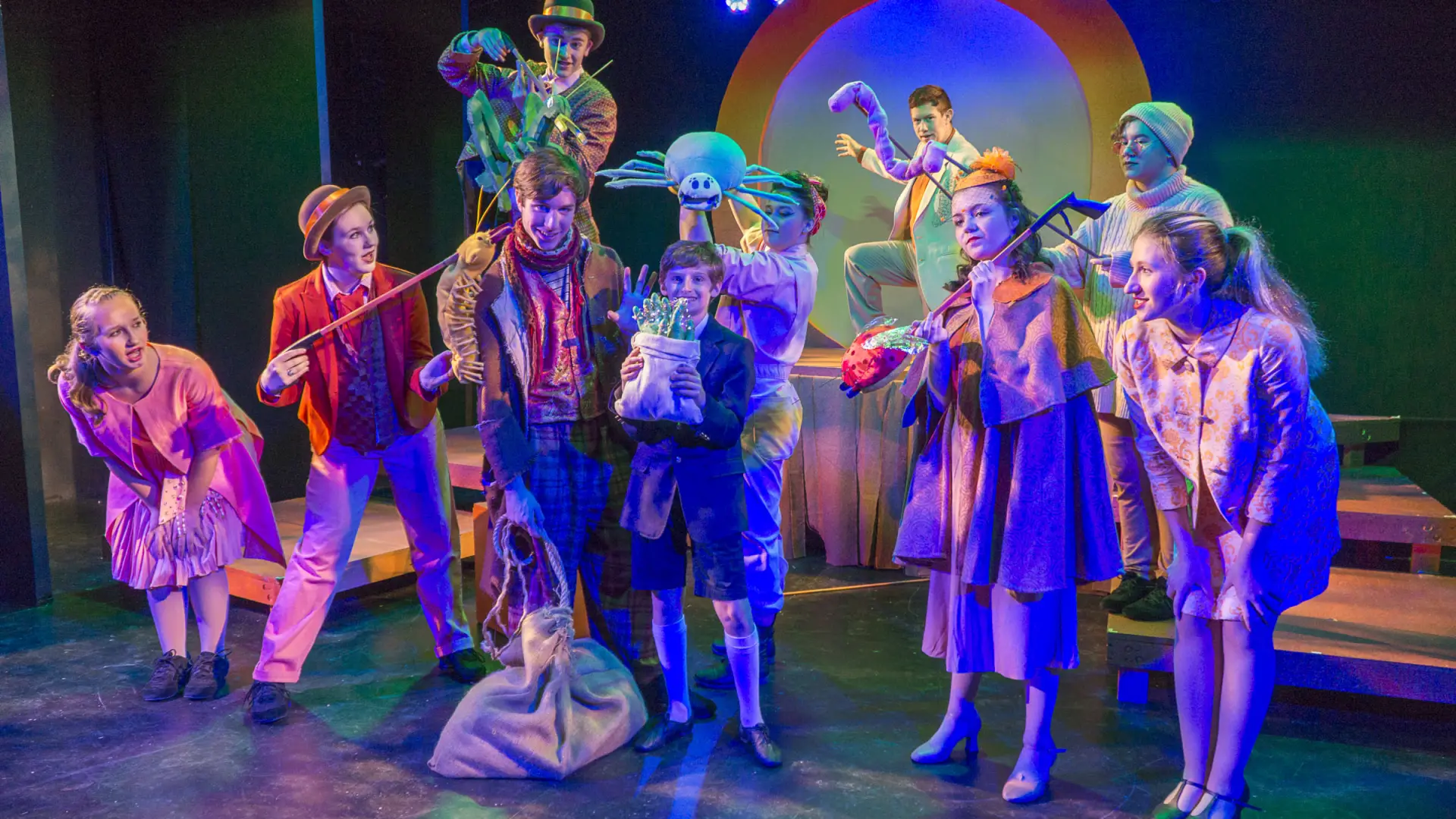 Colorful characters illuminated on stage
