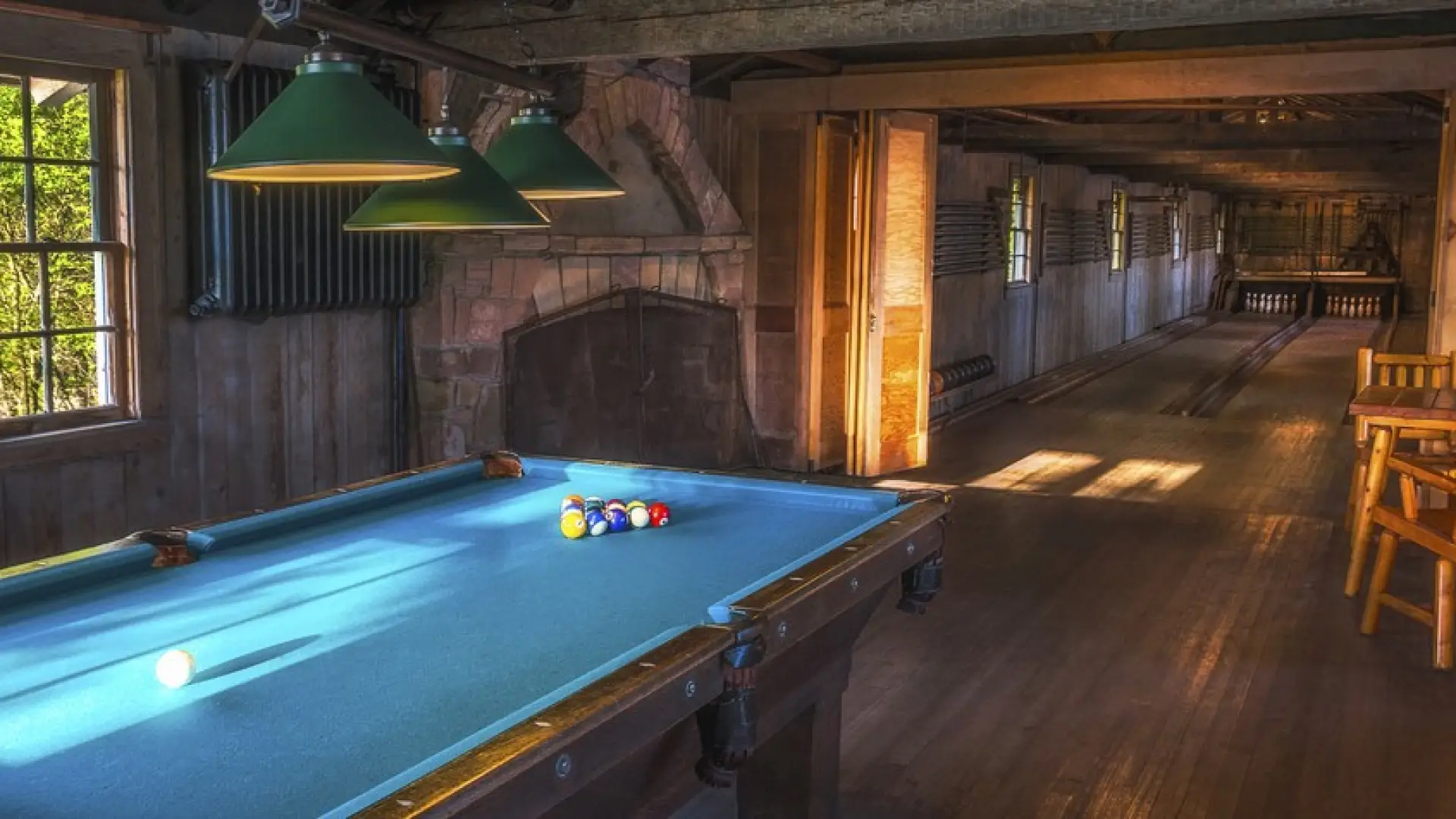 A pool table set to play.