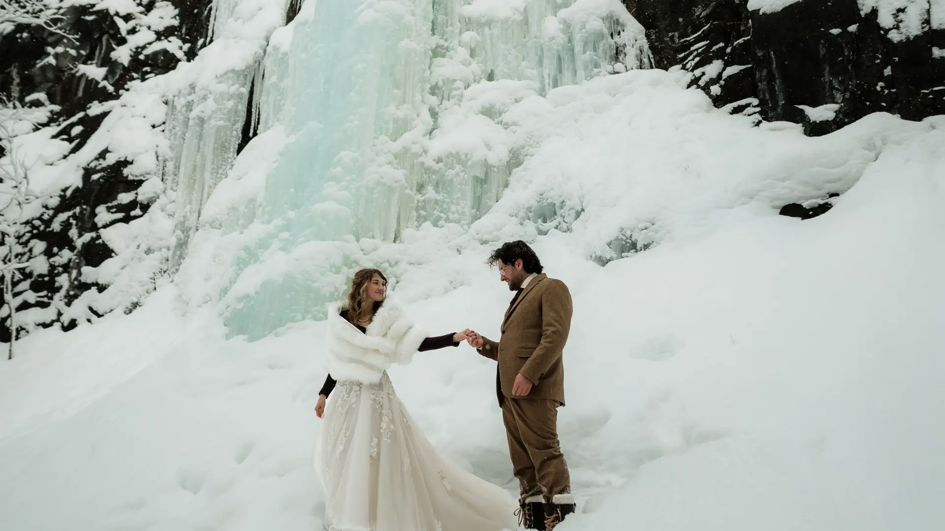 Ice flows behind a bride and groom