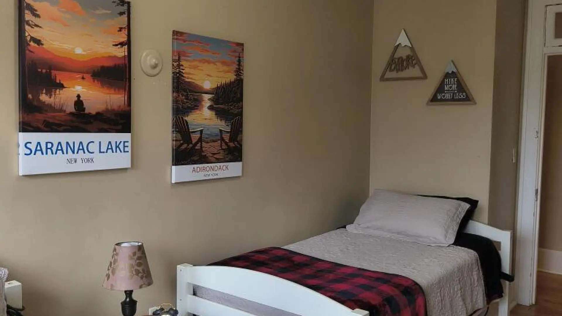 A cozy room with two twin sized beds.