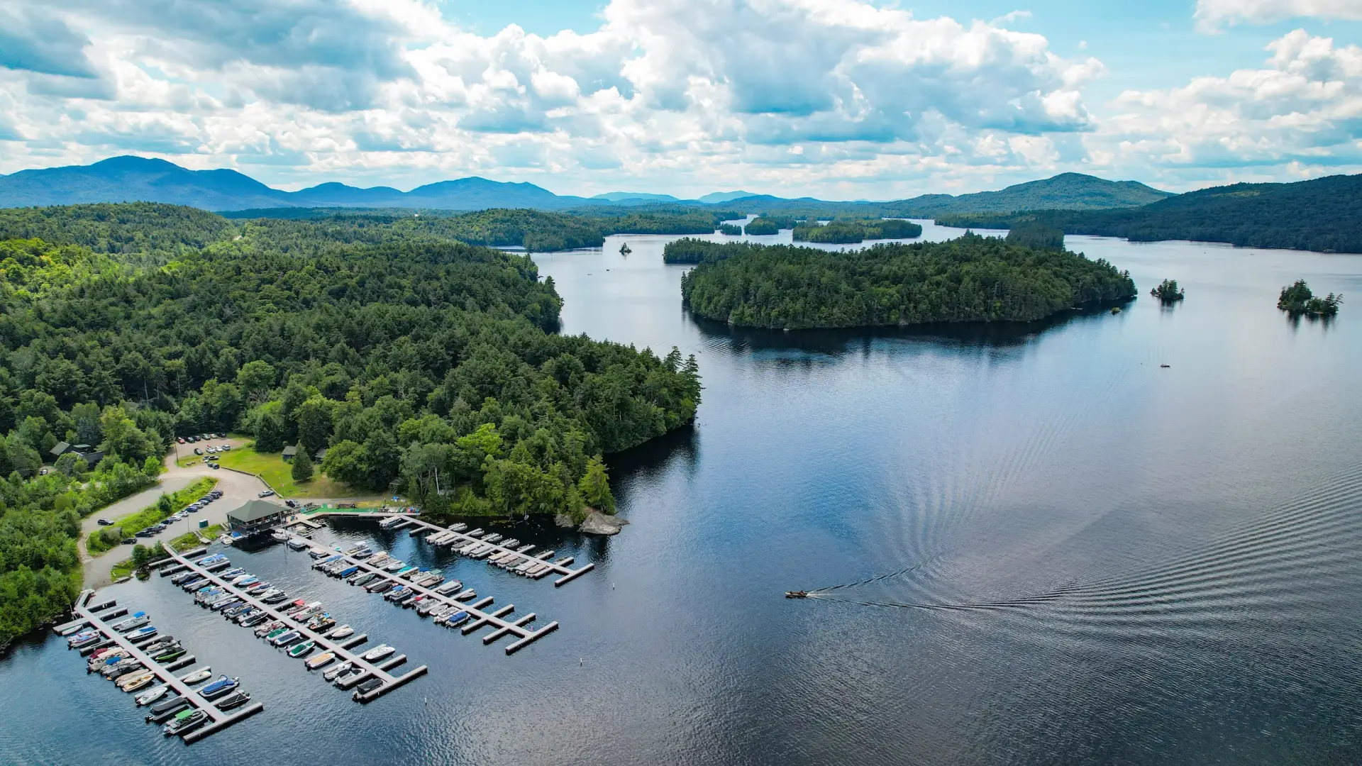 drone view of marina and lower saranac lake in the adirondack mountains
