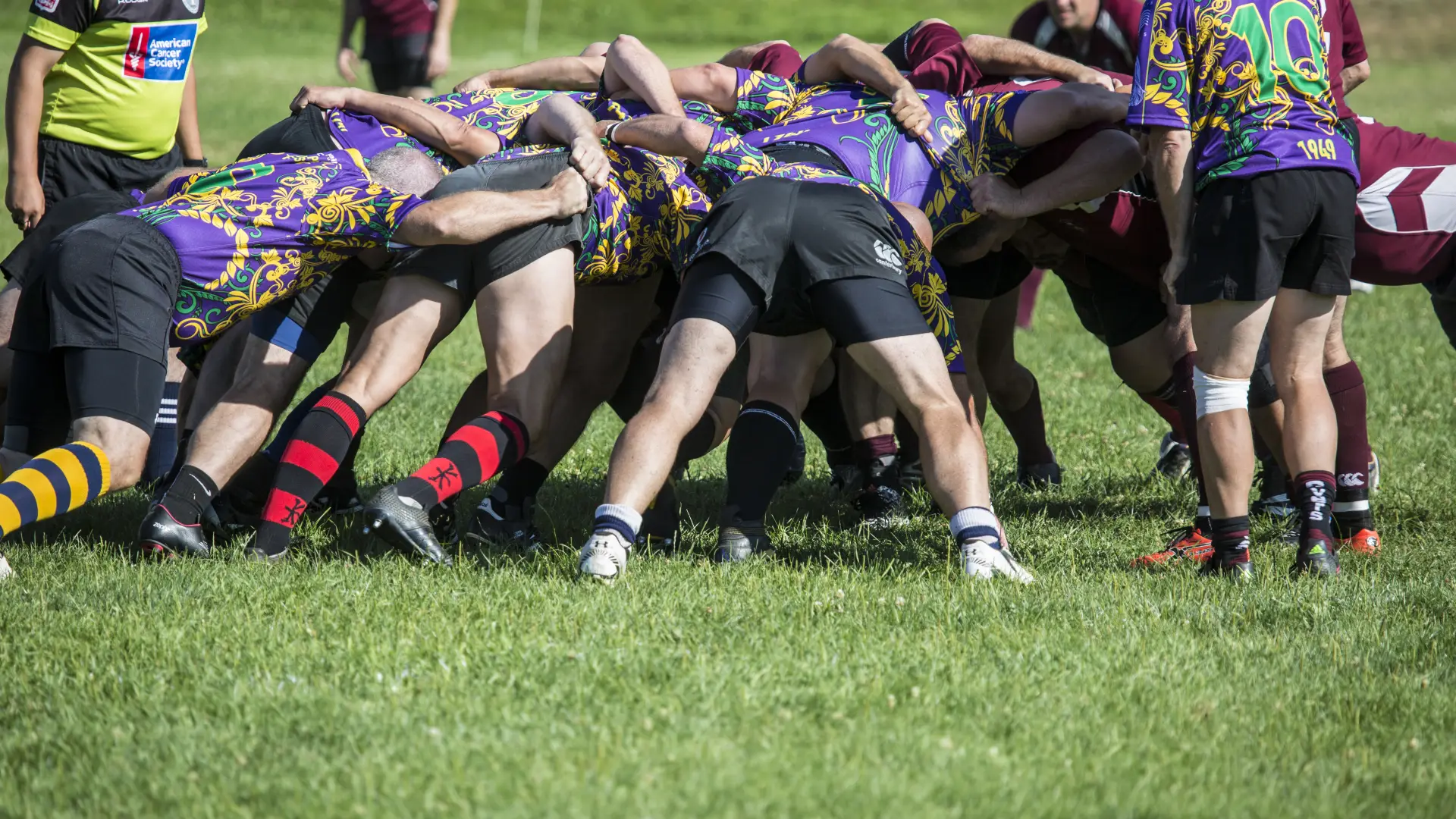 Players gathered in a tight huddle on the field