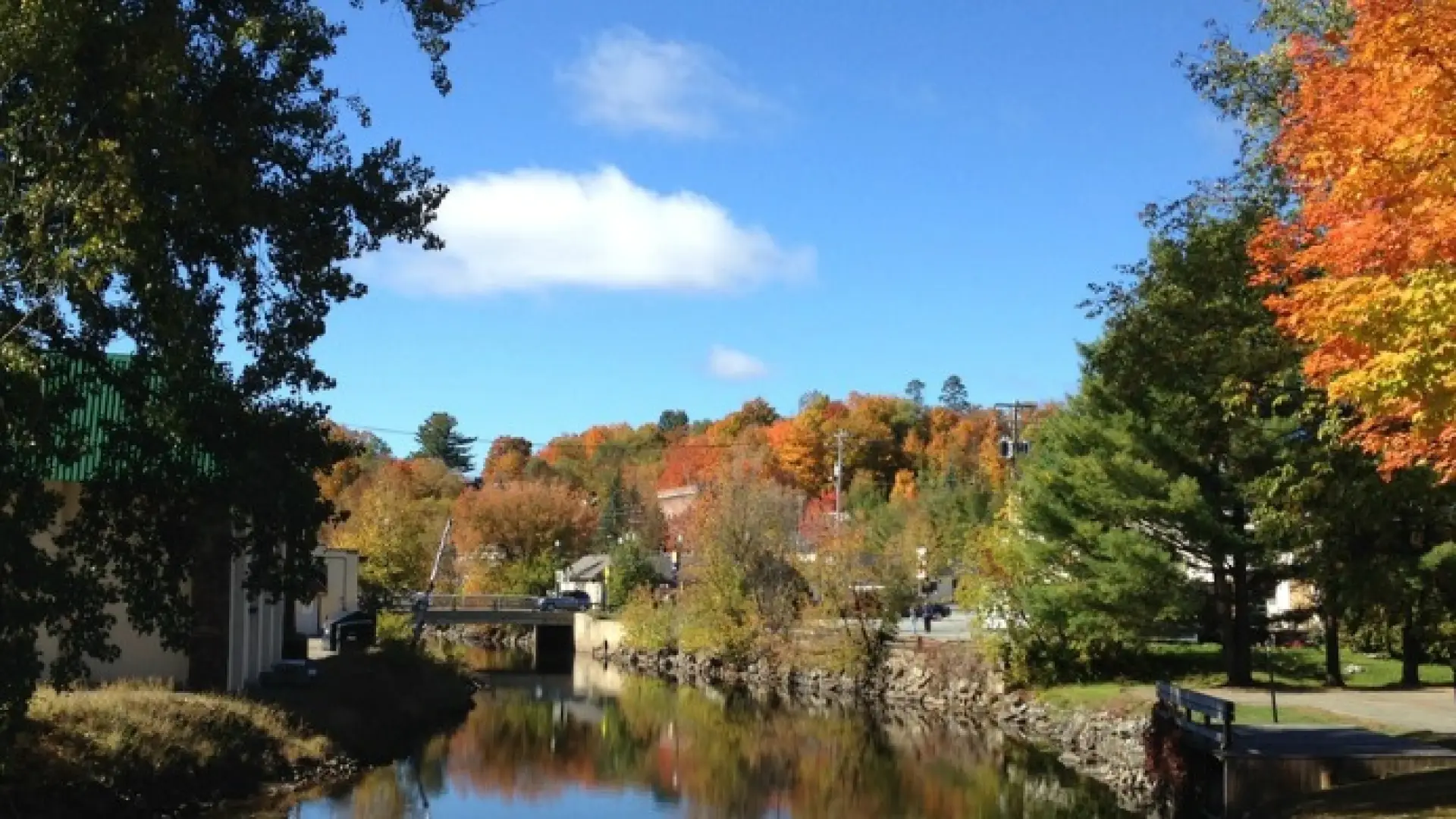 Saranac Lake Riverwalk with fall foliage on dislplay