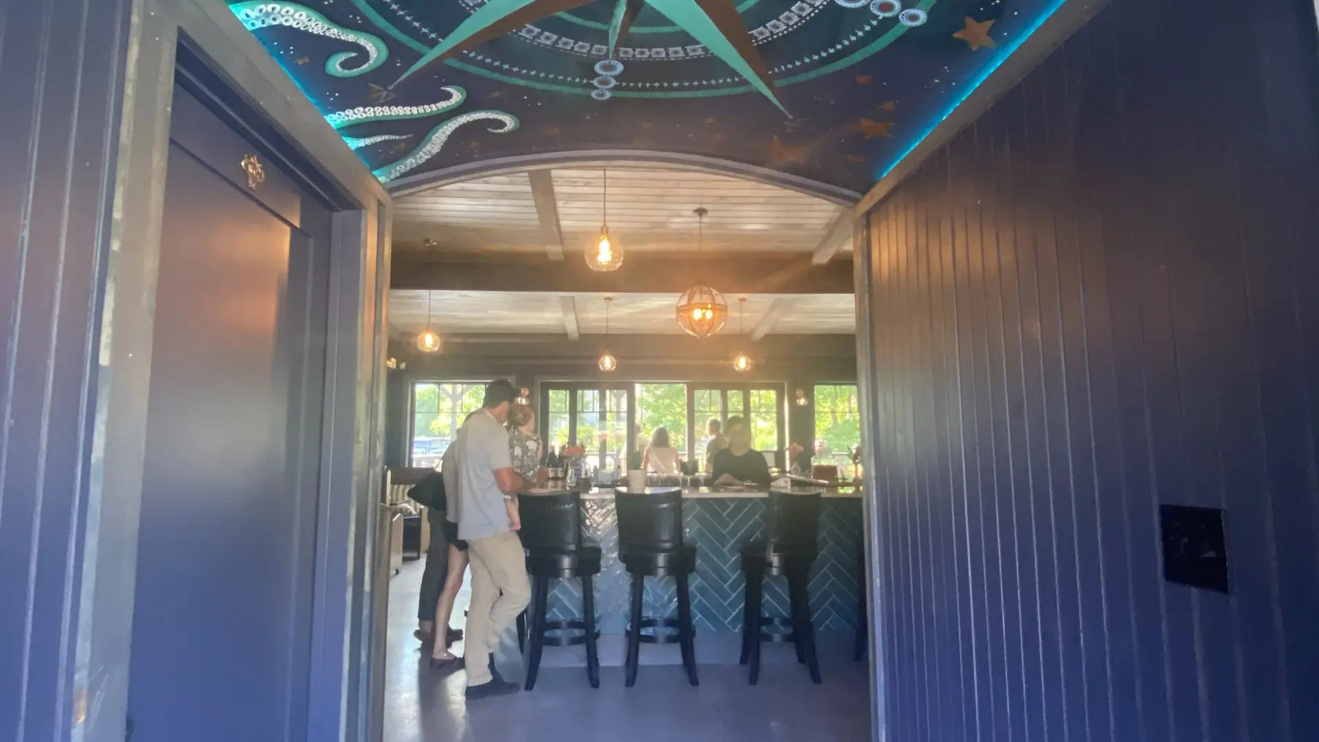 Entry way with ceiling mural of a cardinal directions compass