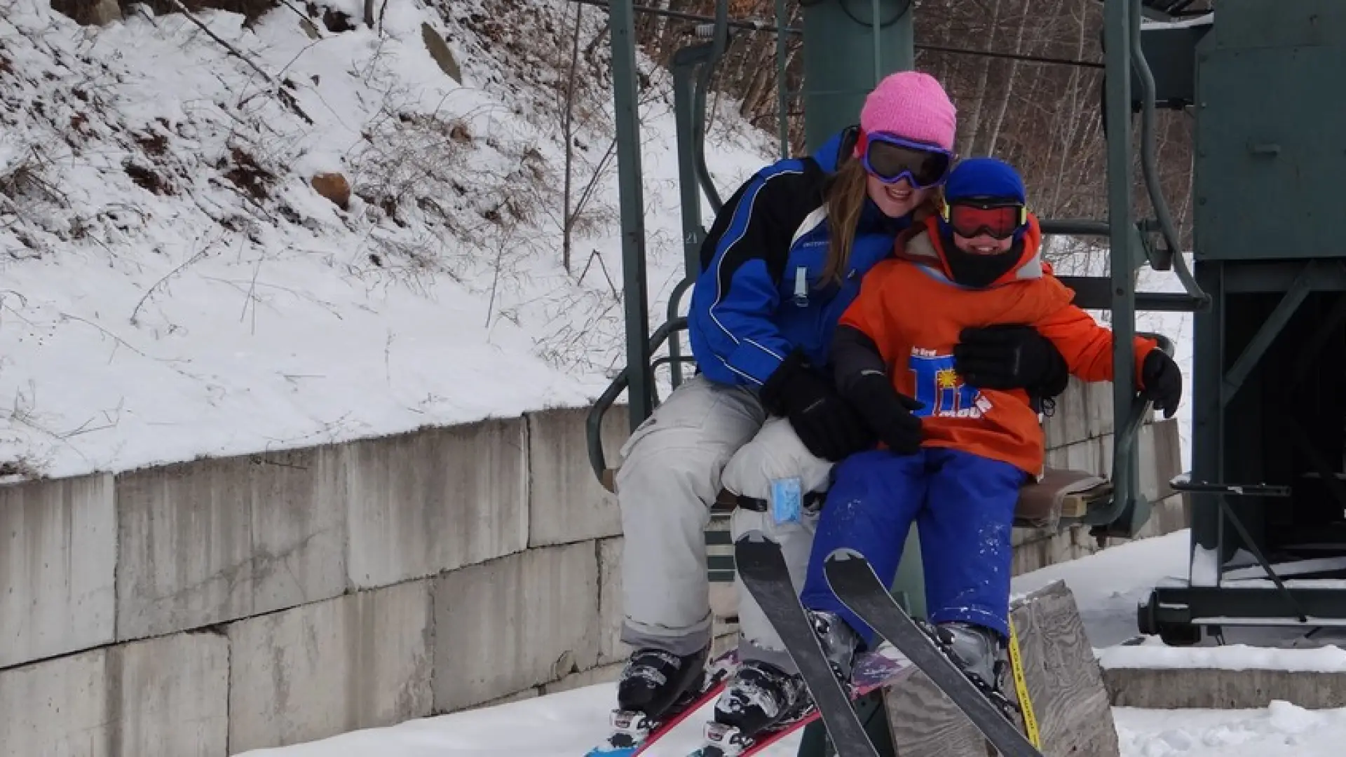 A couple kids on the ski lift at Titus Mountain.
