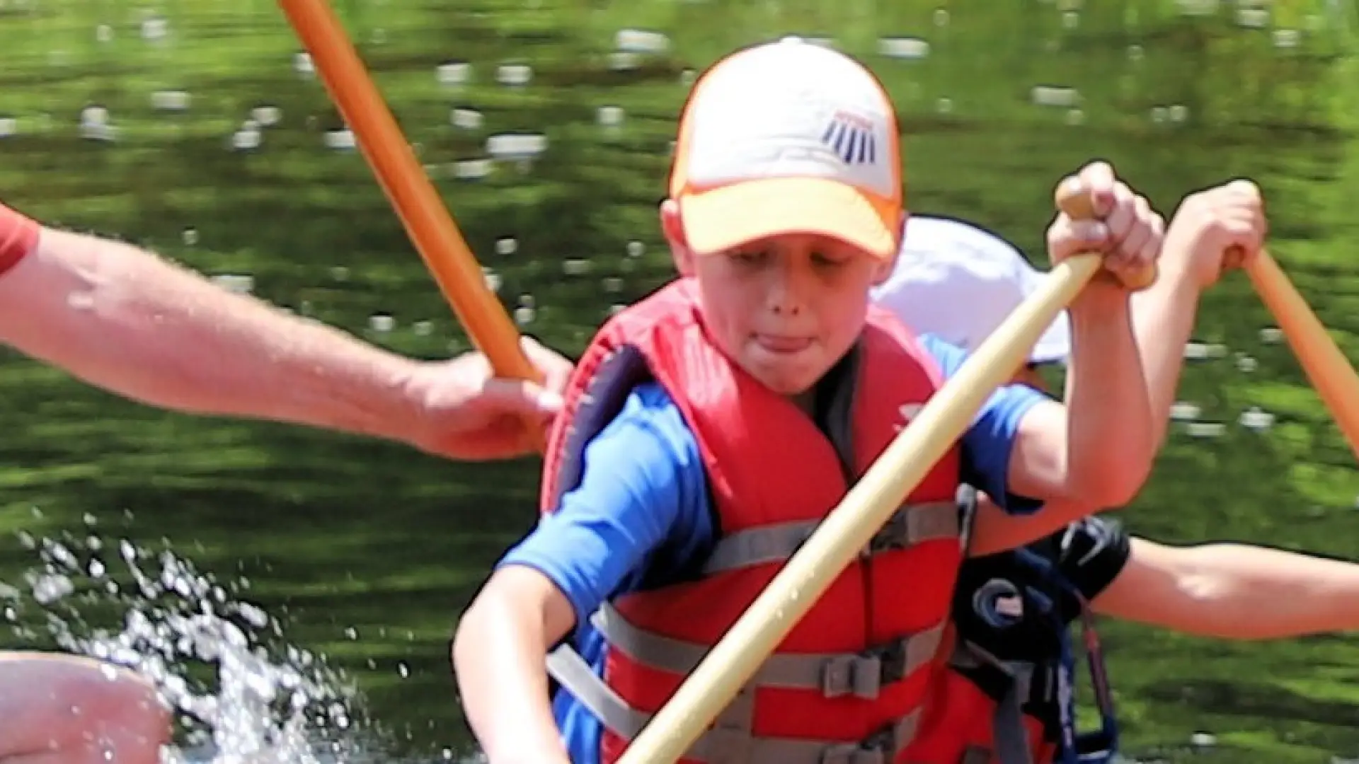 A young paddler is very focused on his technique