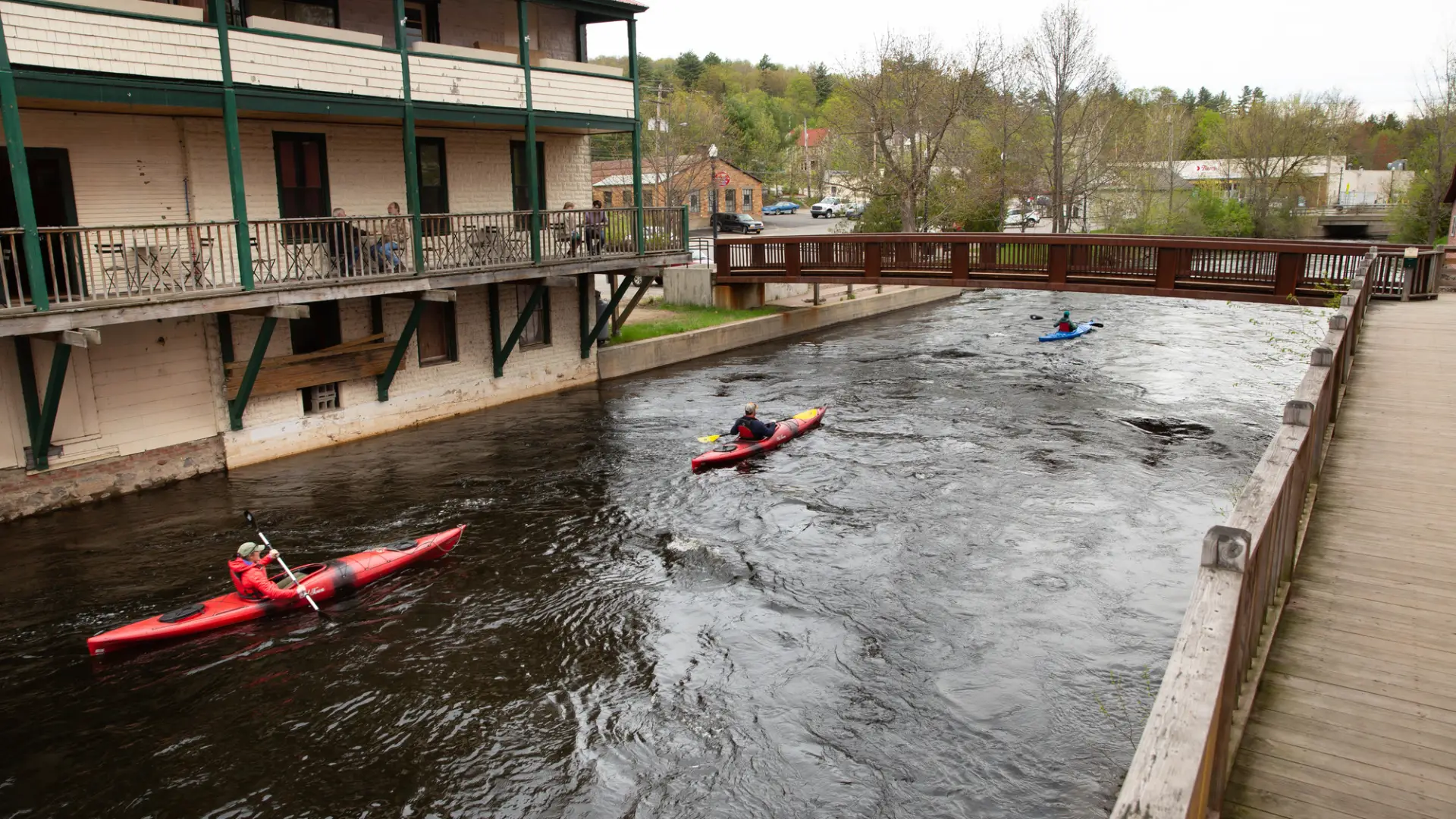 Paddlers in the town of Saranac Lake, on the Saranac River
