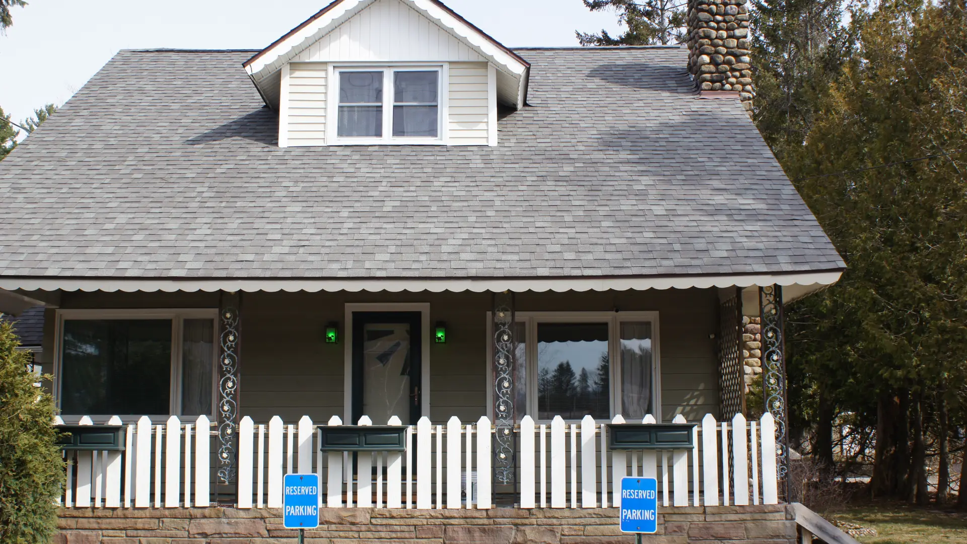 The house from the front with white picket fence at The Ashley.