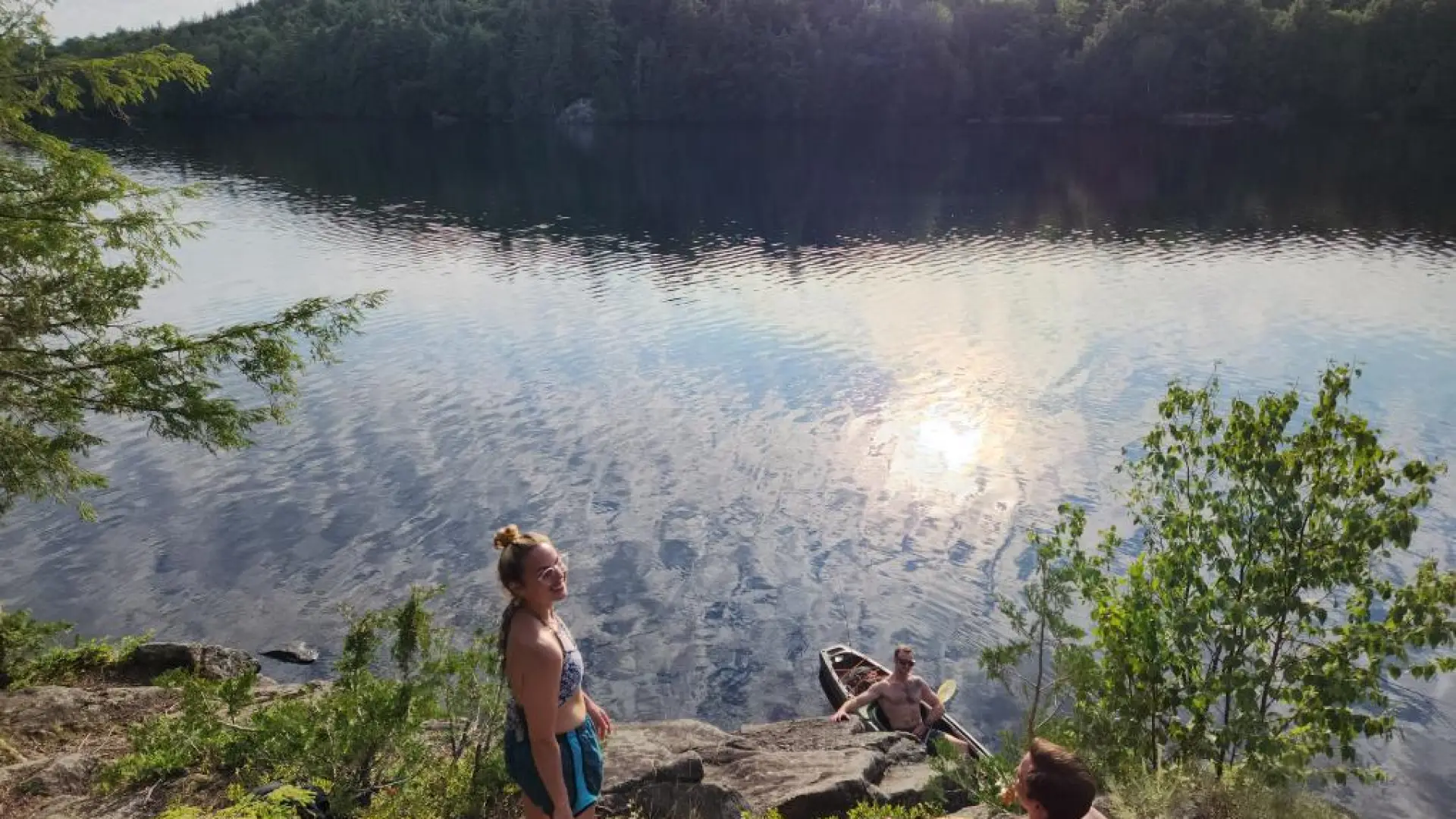 Swimmers on the shore of Moose Pond.