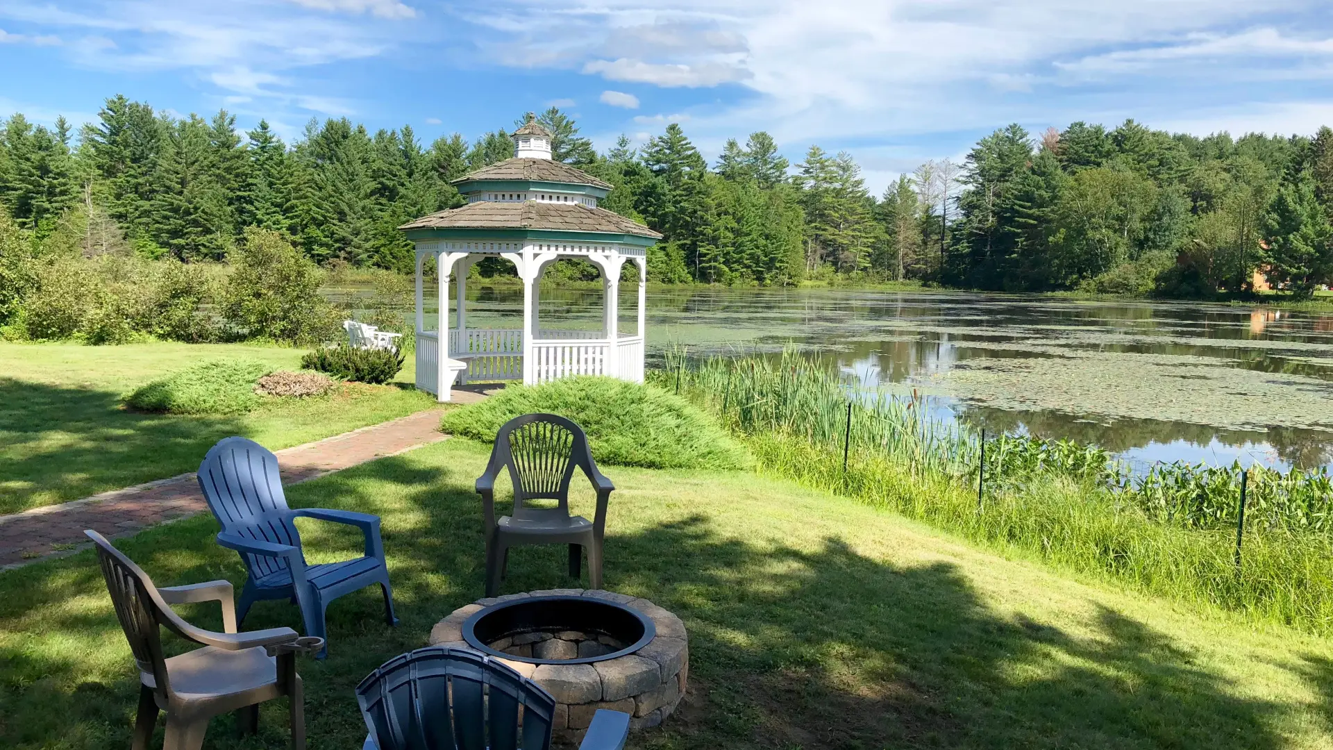 The white gazebo by the water at Sara Placid Inn & Suites.