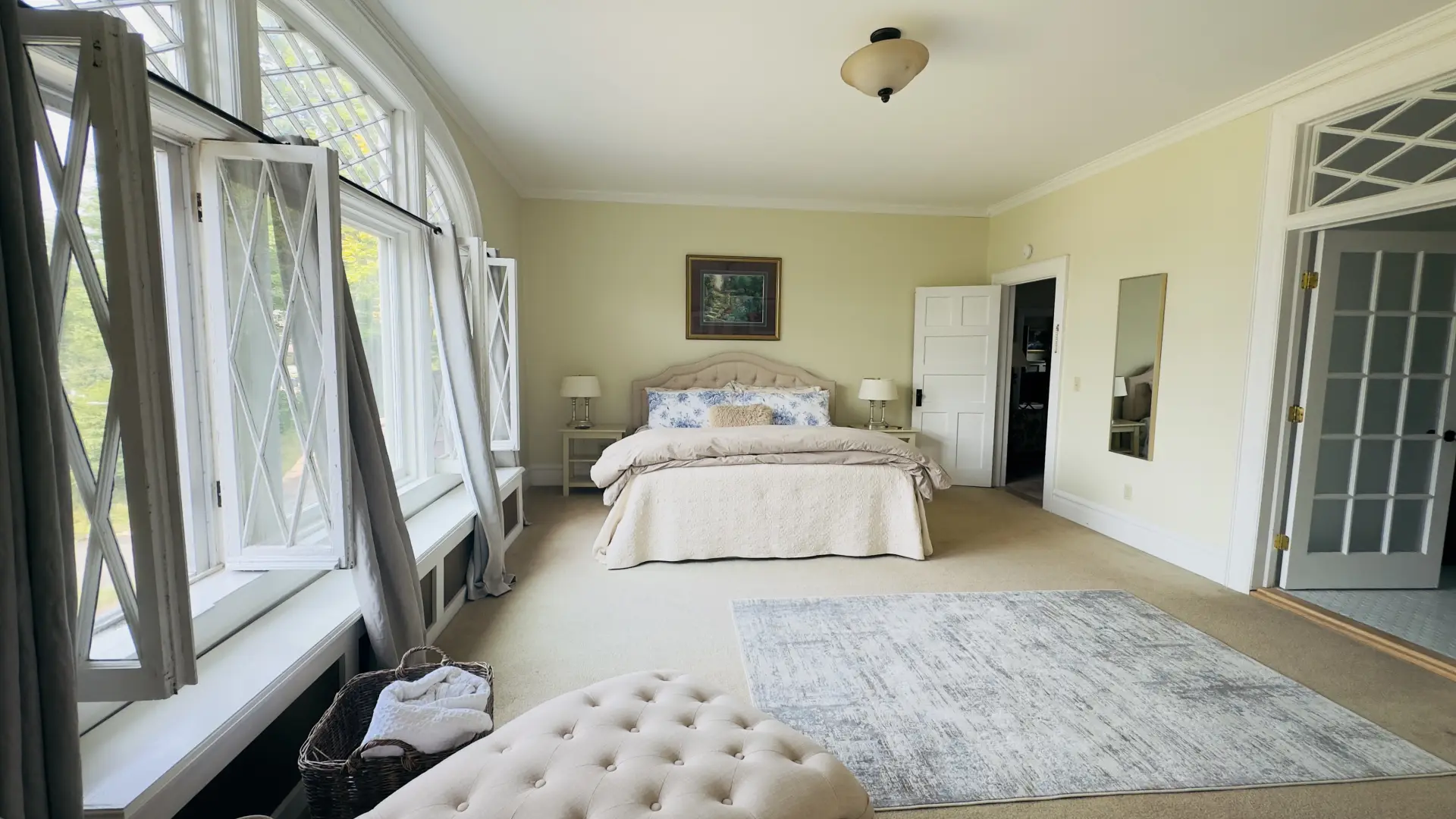 Huge bright room with massive windows and transoms allowing ample light
