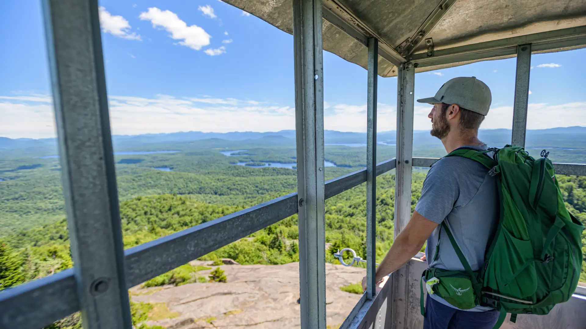 A hiker standing in the St Regis firetower