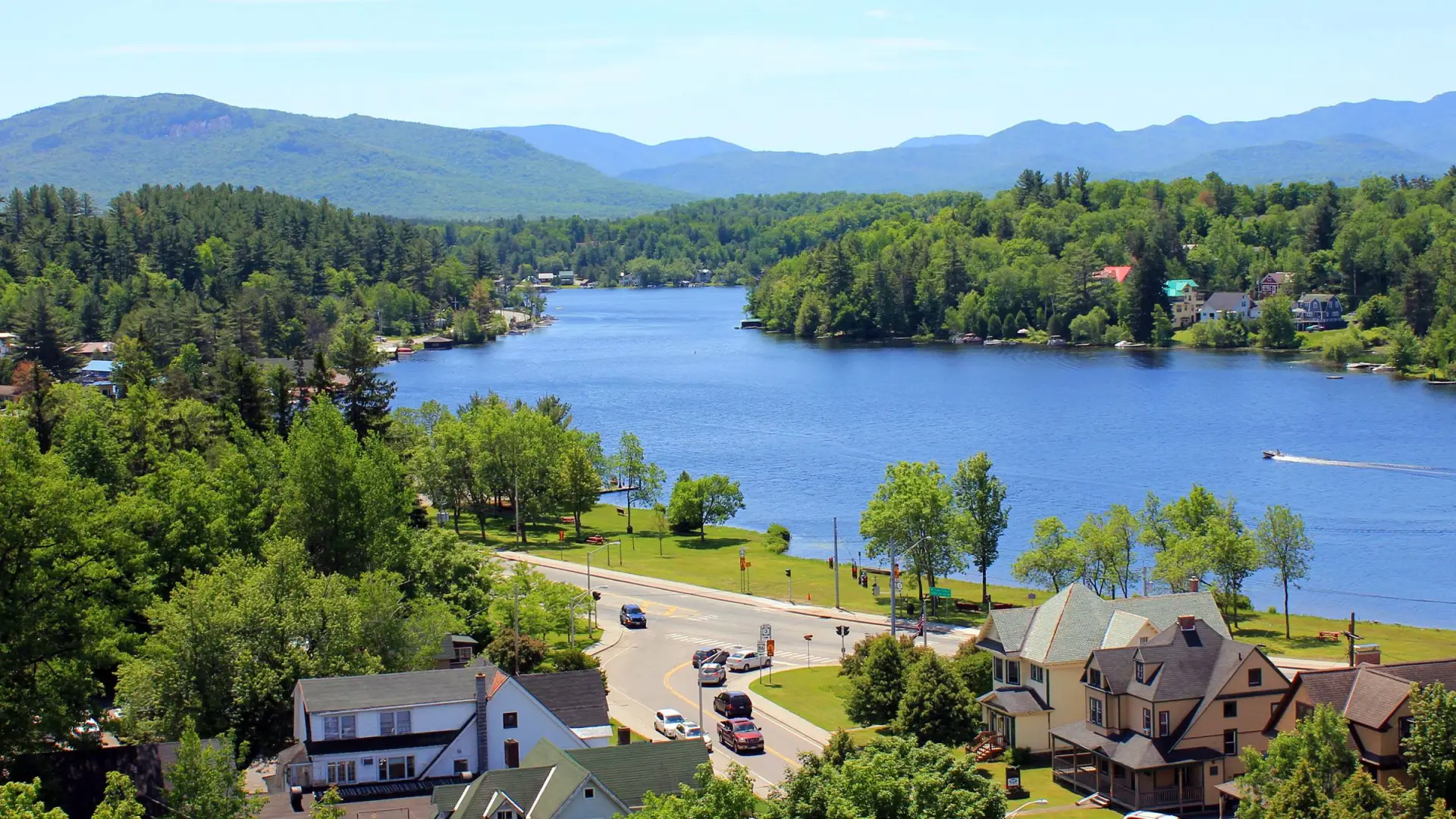 An aerial view of the lake surrounded by mountains.