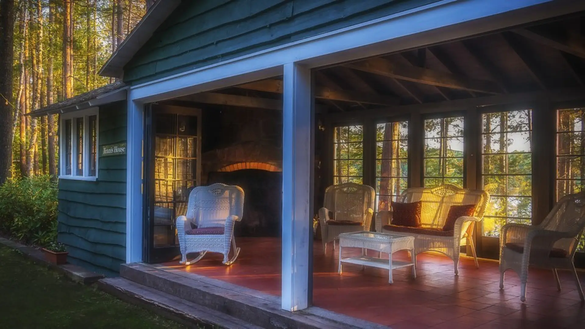 Looking through the window at white whicker furniture