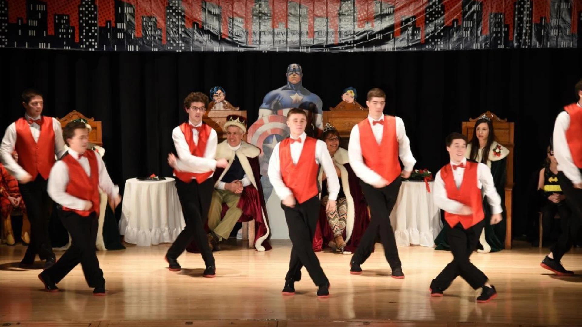 Costumed dancers on stage