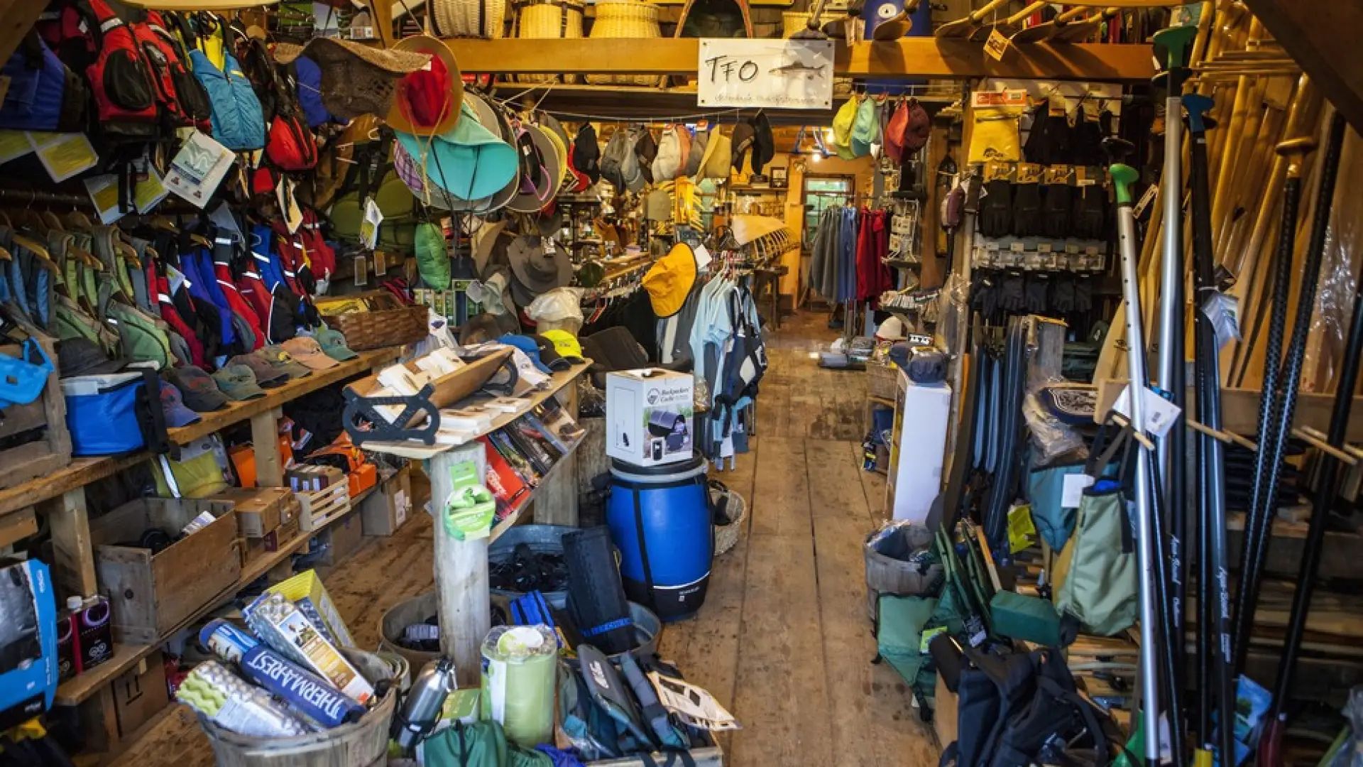 Shelves packed with colorful adventure gear.