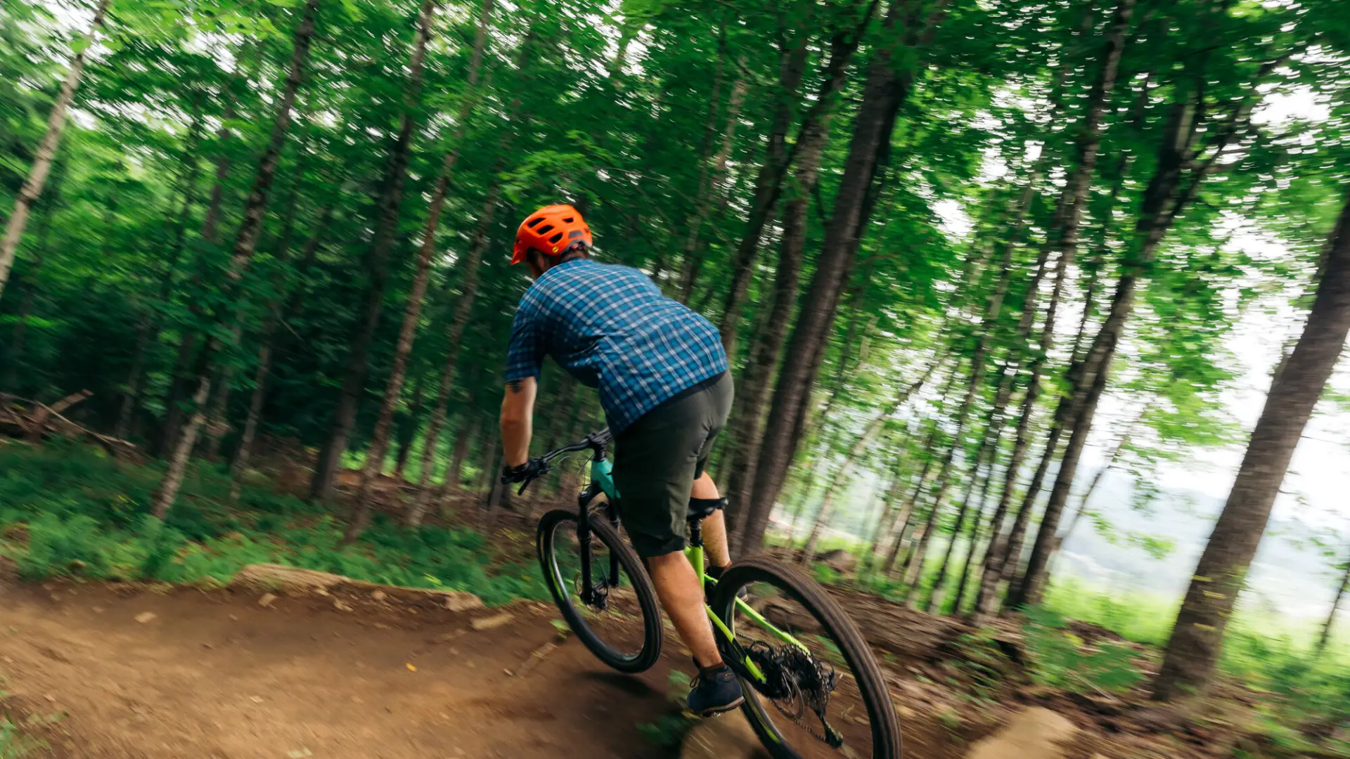 A mountain biker hits a berm