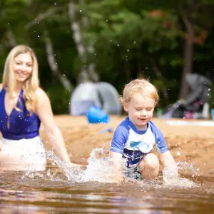 A family swimming in Lake Clear.