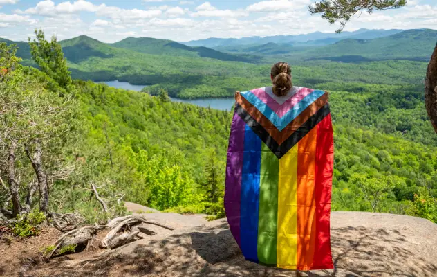 A pride flag on a hike.