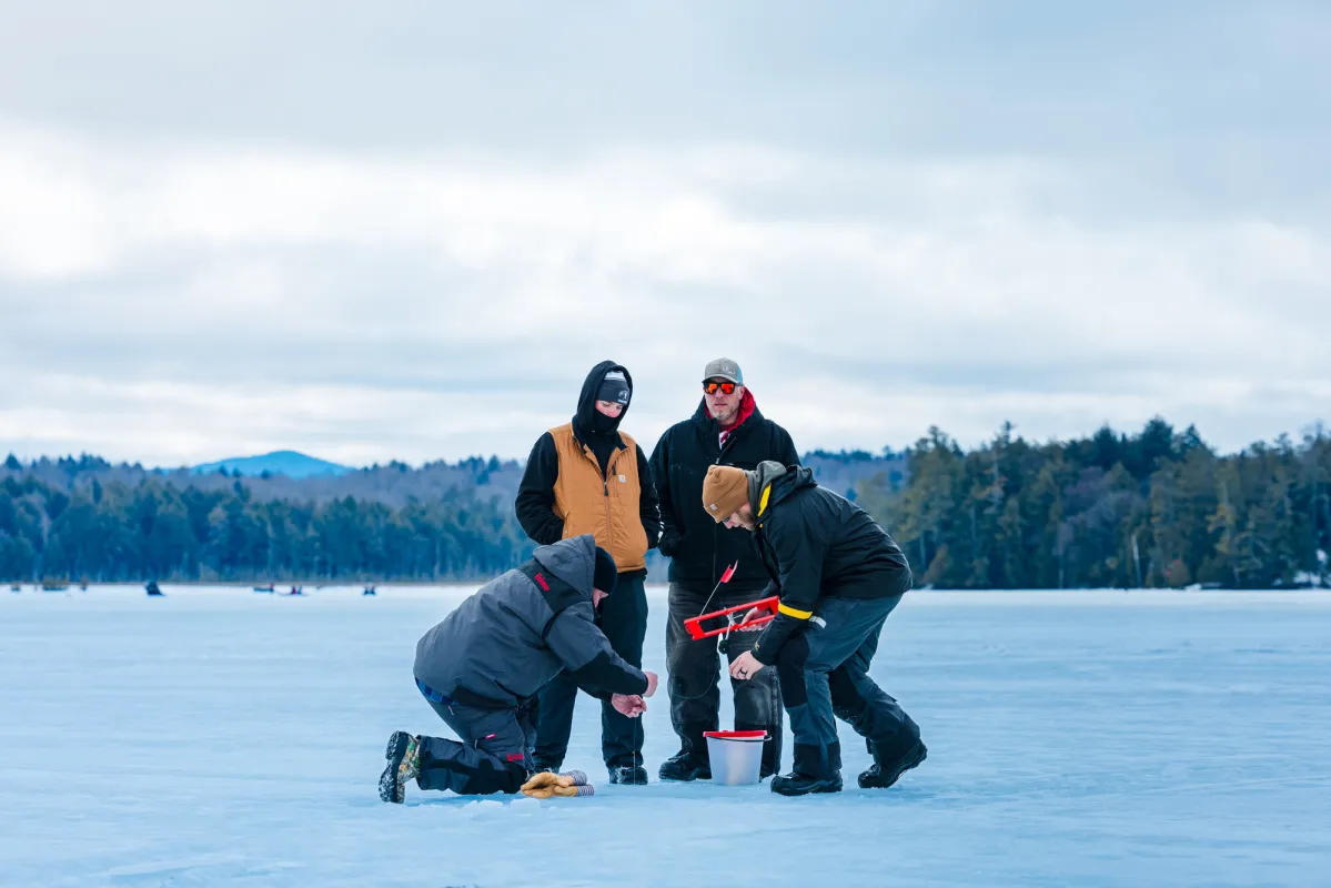 Guided ice fishing in Saranac Lake.