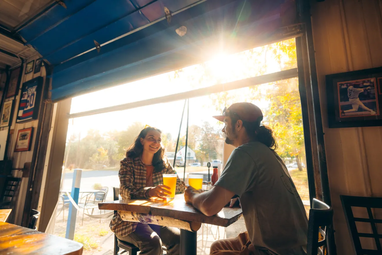A couple at a brewery in Saranac Lake.