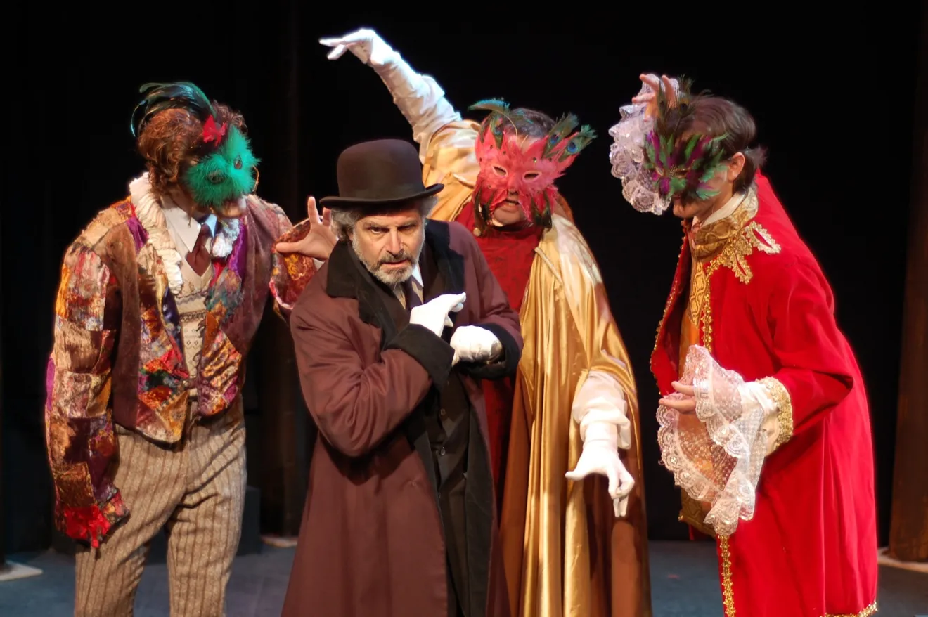 Costumed performers dance on a stage.