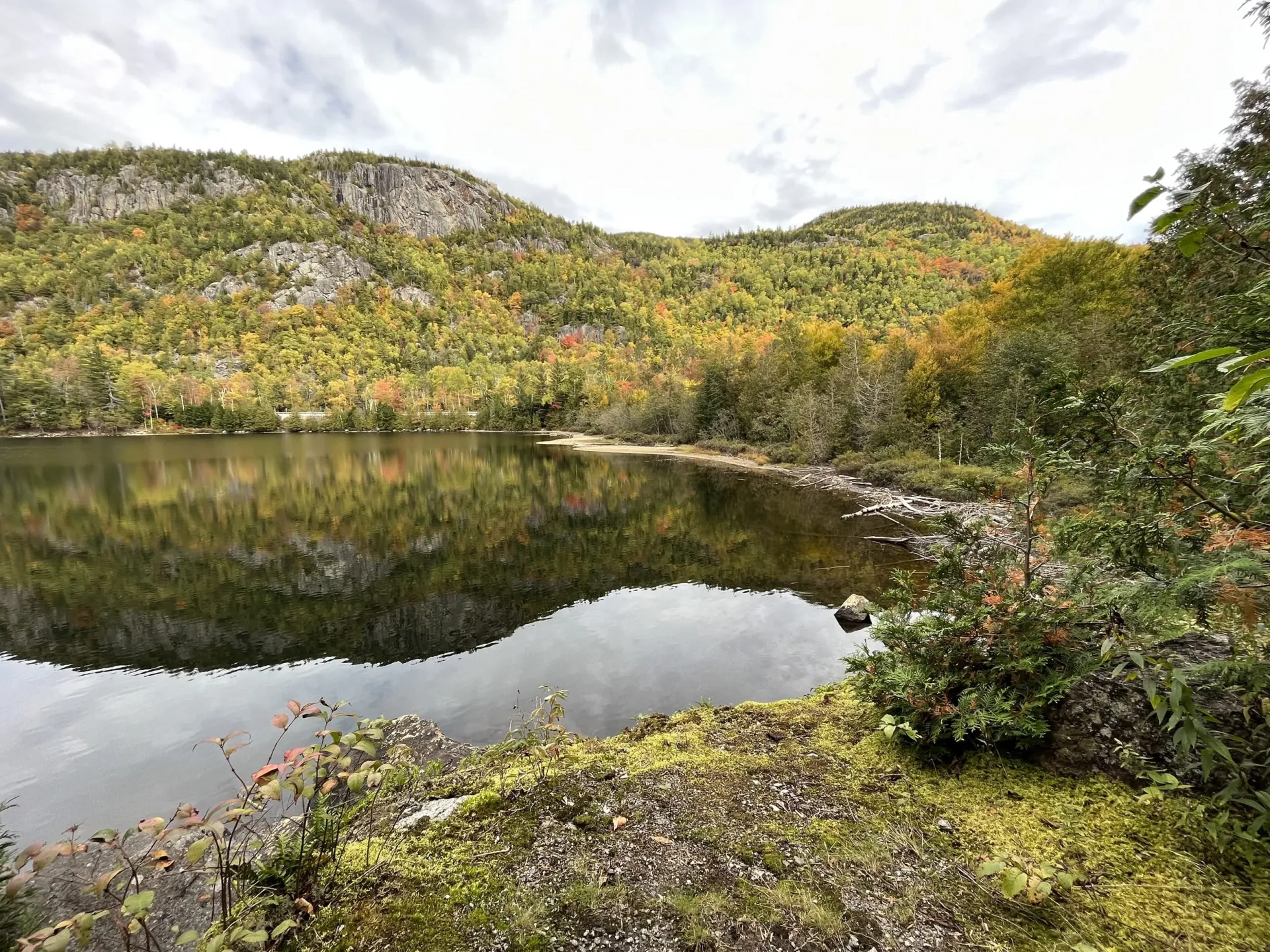View of an isolated alpine lake with a beautiful peak in the background