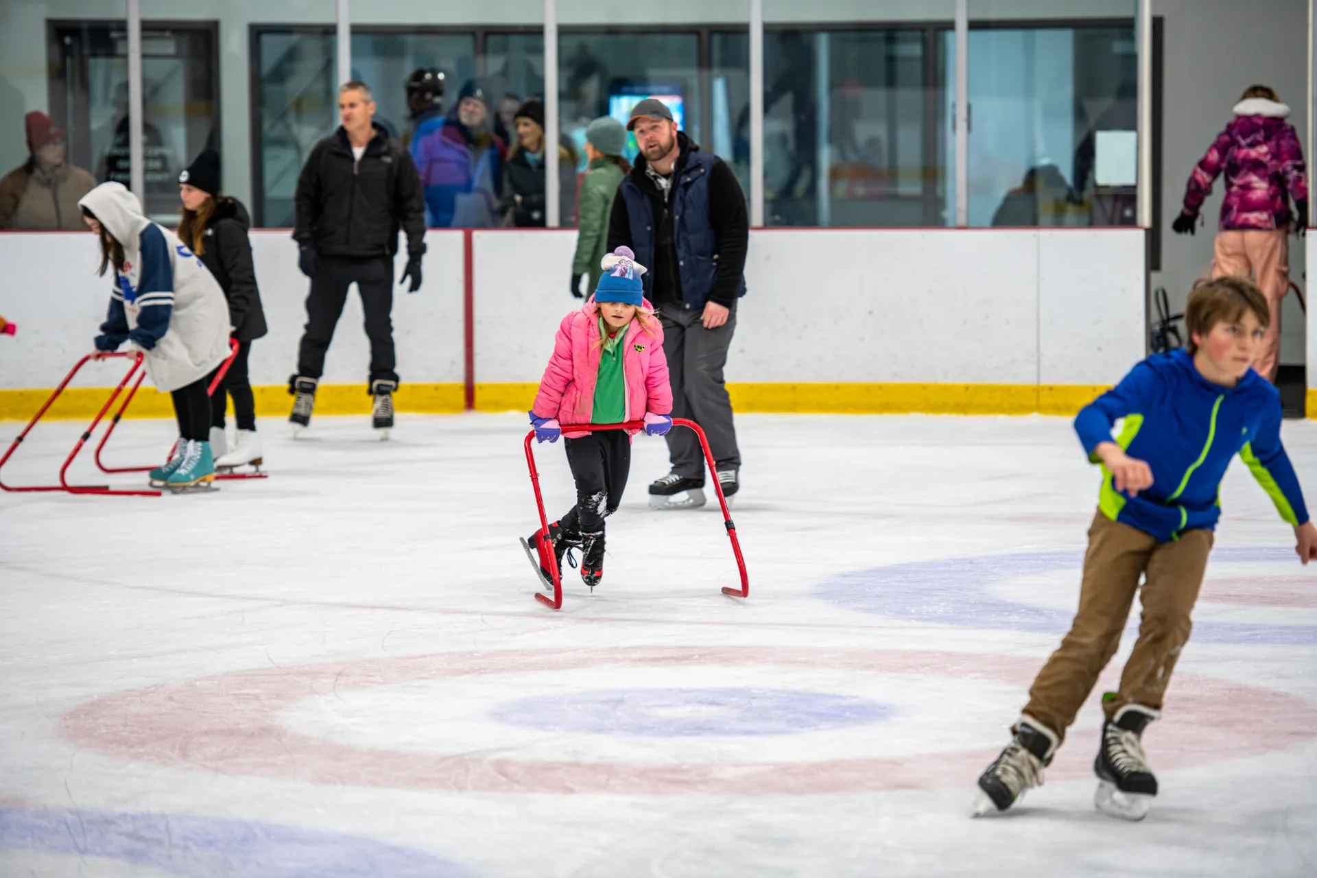 Kids skating with their parents