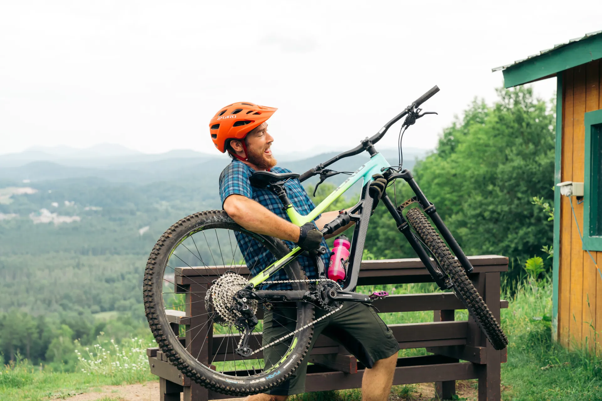 A mountain biker uses his bike as a guitar