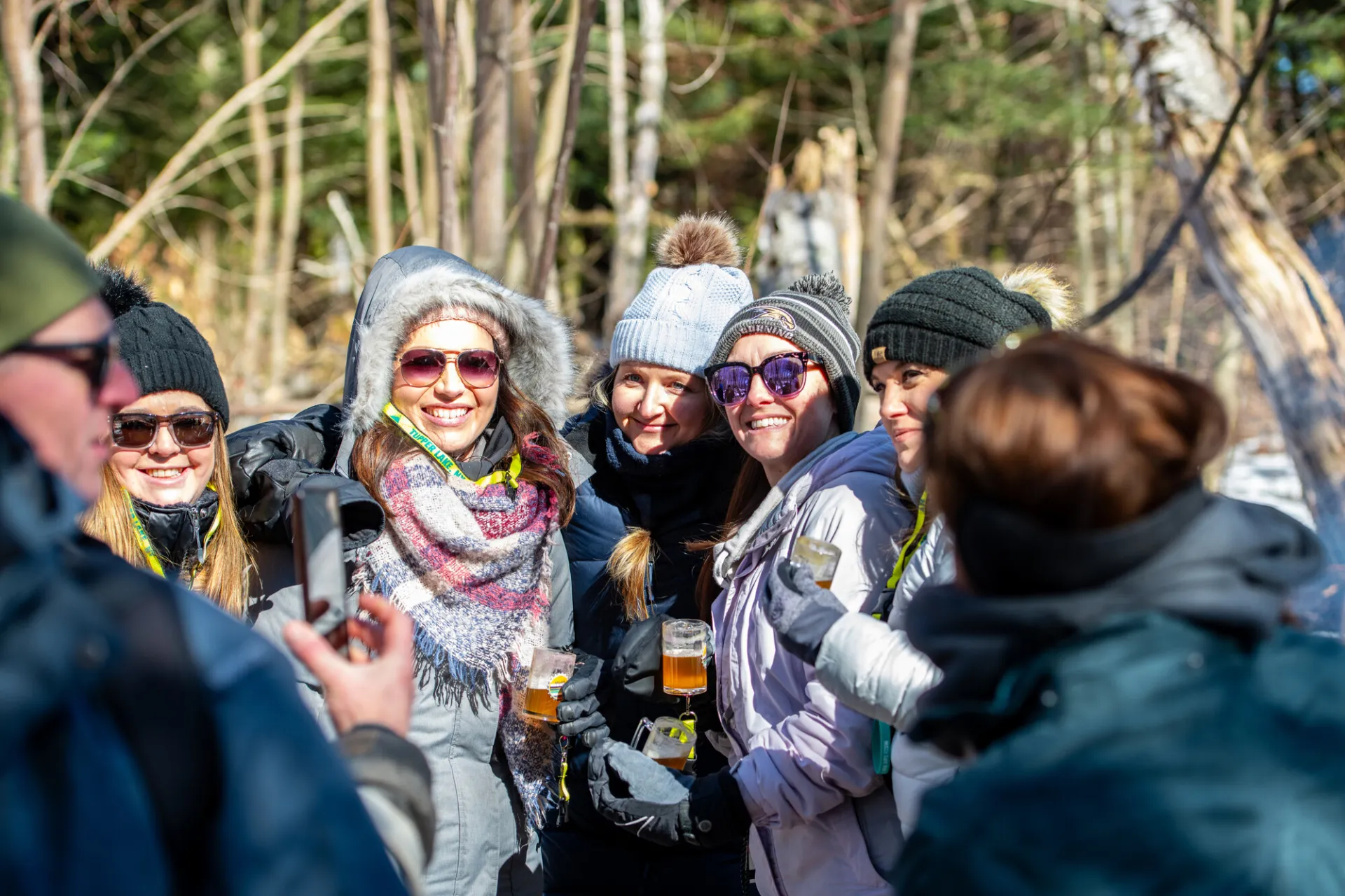 Group of skiers cheers on the trail.  