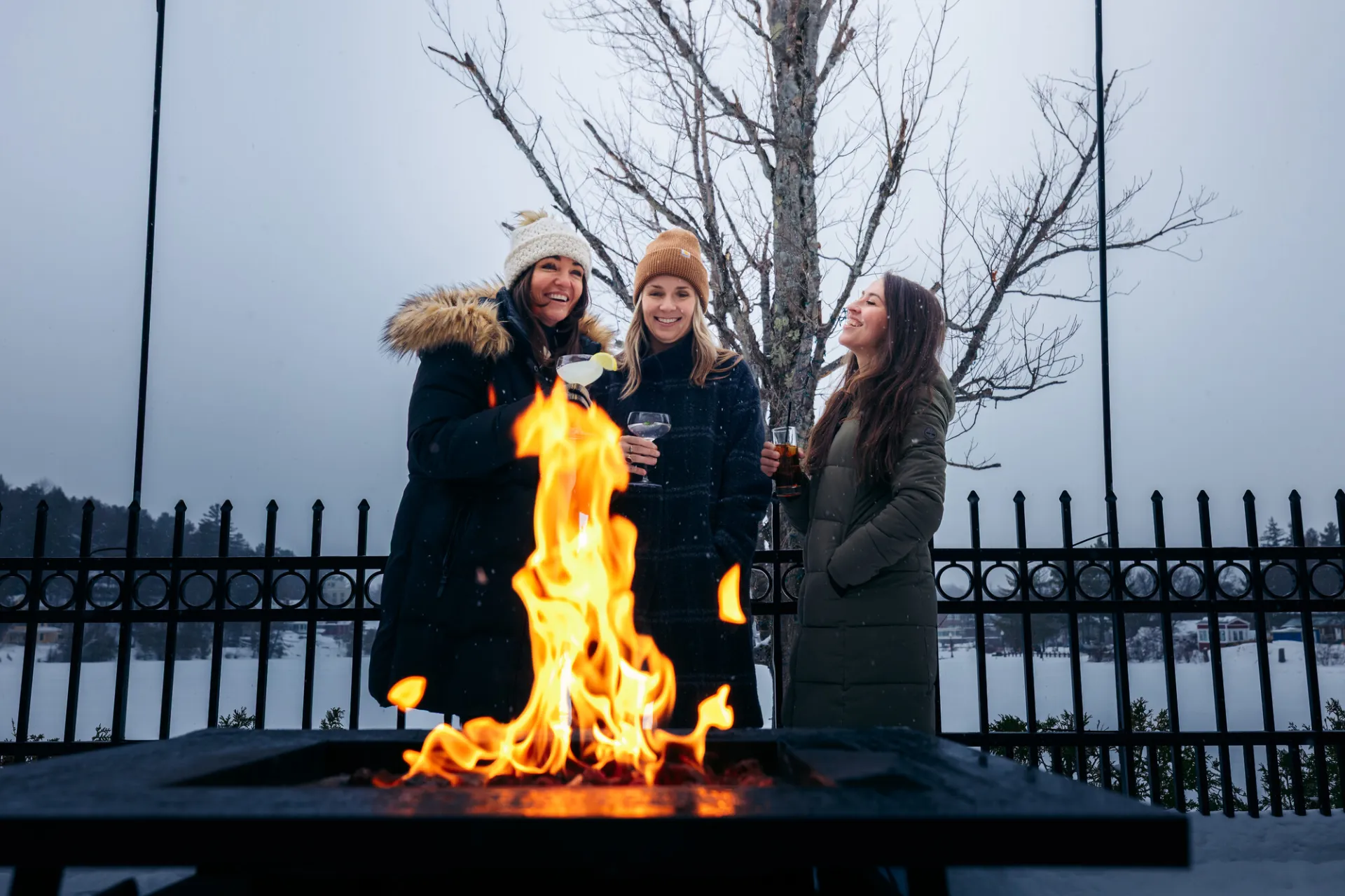 Grabbing drinks by a firepit.