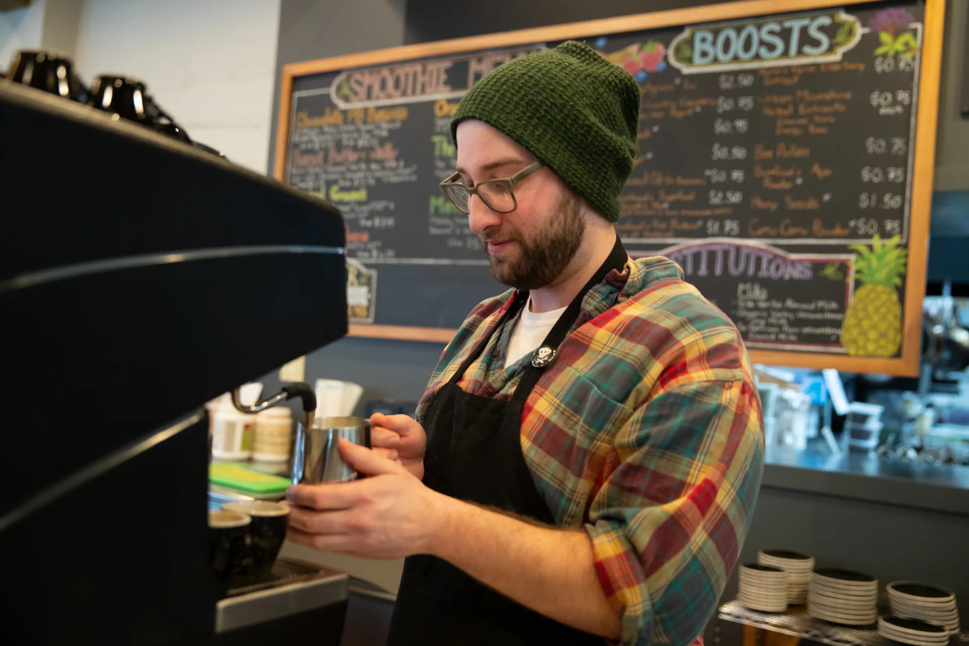 A person working in a coffee shop.