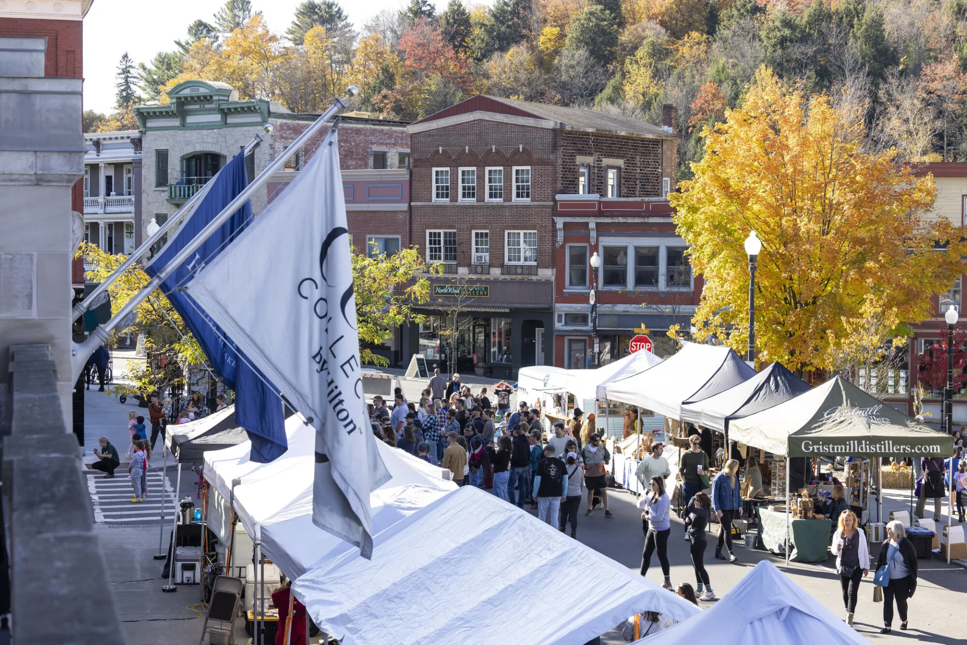 A farmers market in the middle of a town. 