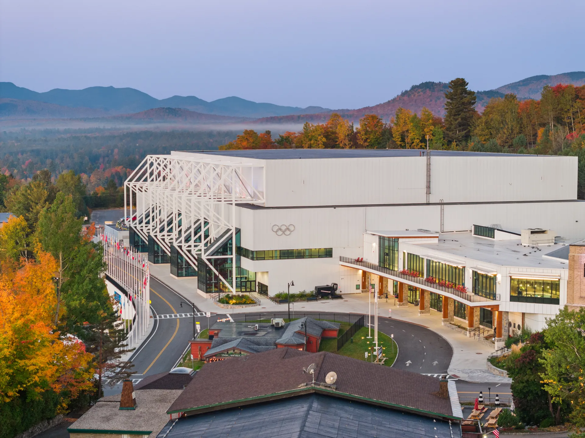 Olympic Center building where hockey rinks are located seen from aerial exterior in fall