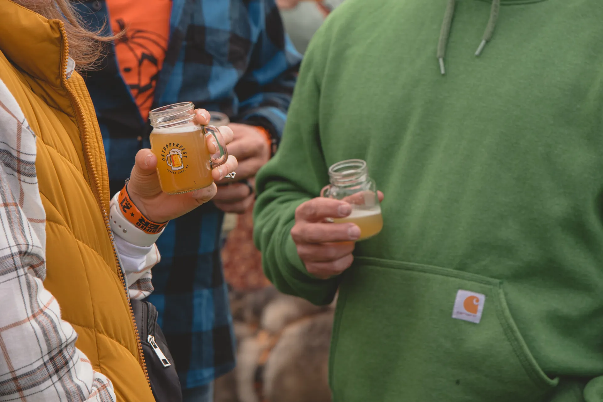 Close up of a couple drinking beer samples at OkTupperfest