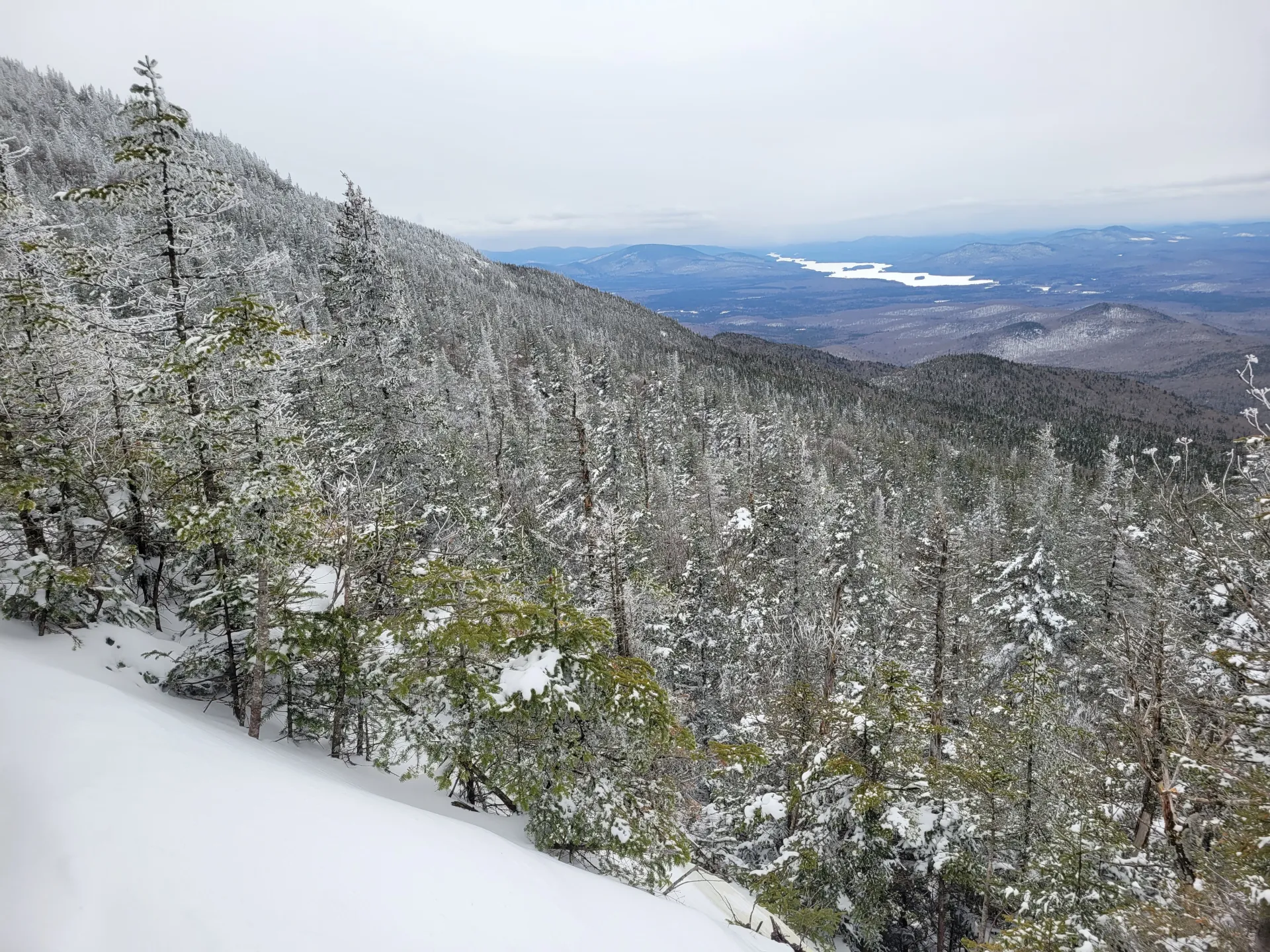 view down towards a long lake in the winter