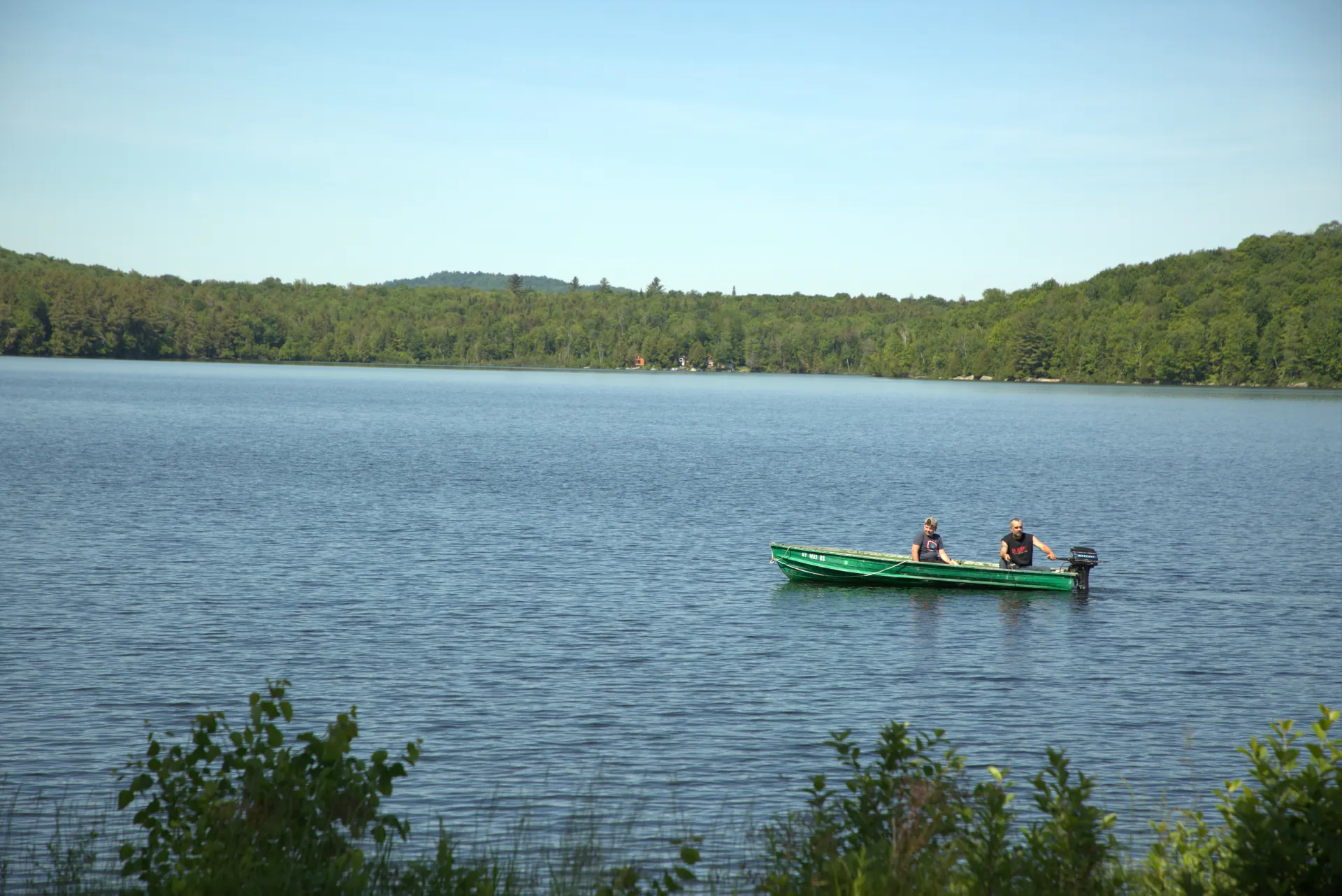 green row boat on Lake. Sunny summer day