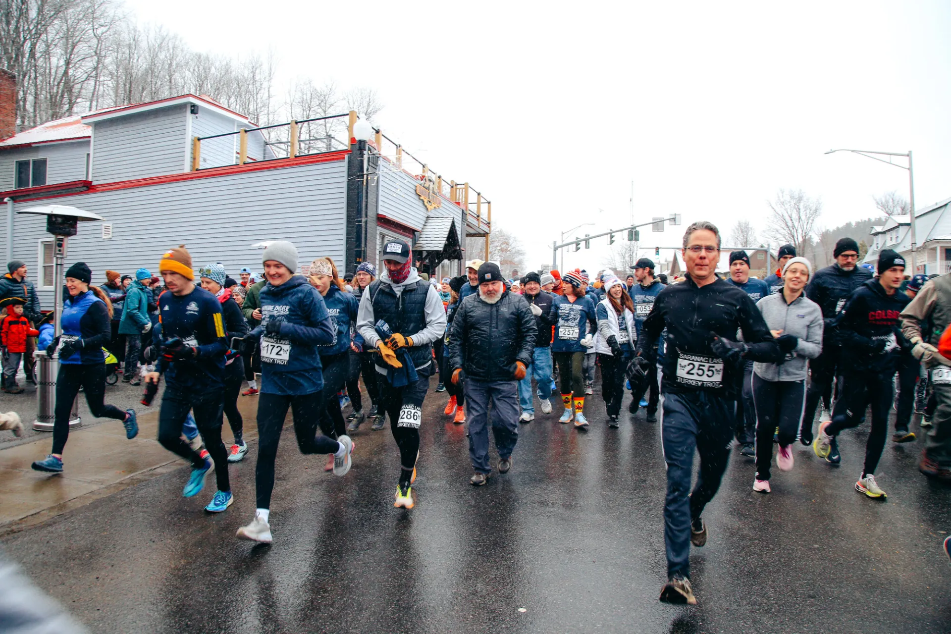 close up of runners coming towards the camera in winter gear