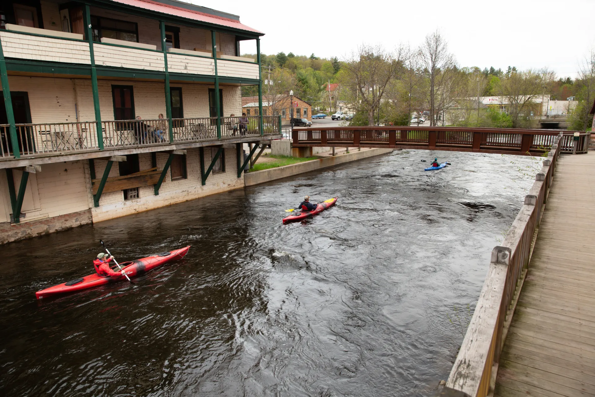 Paddlers in the town of Saranac Lake, on the Saranac River